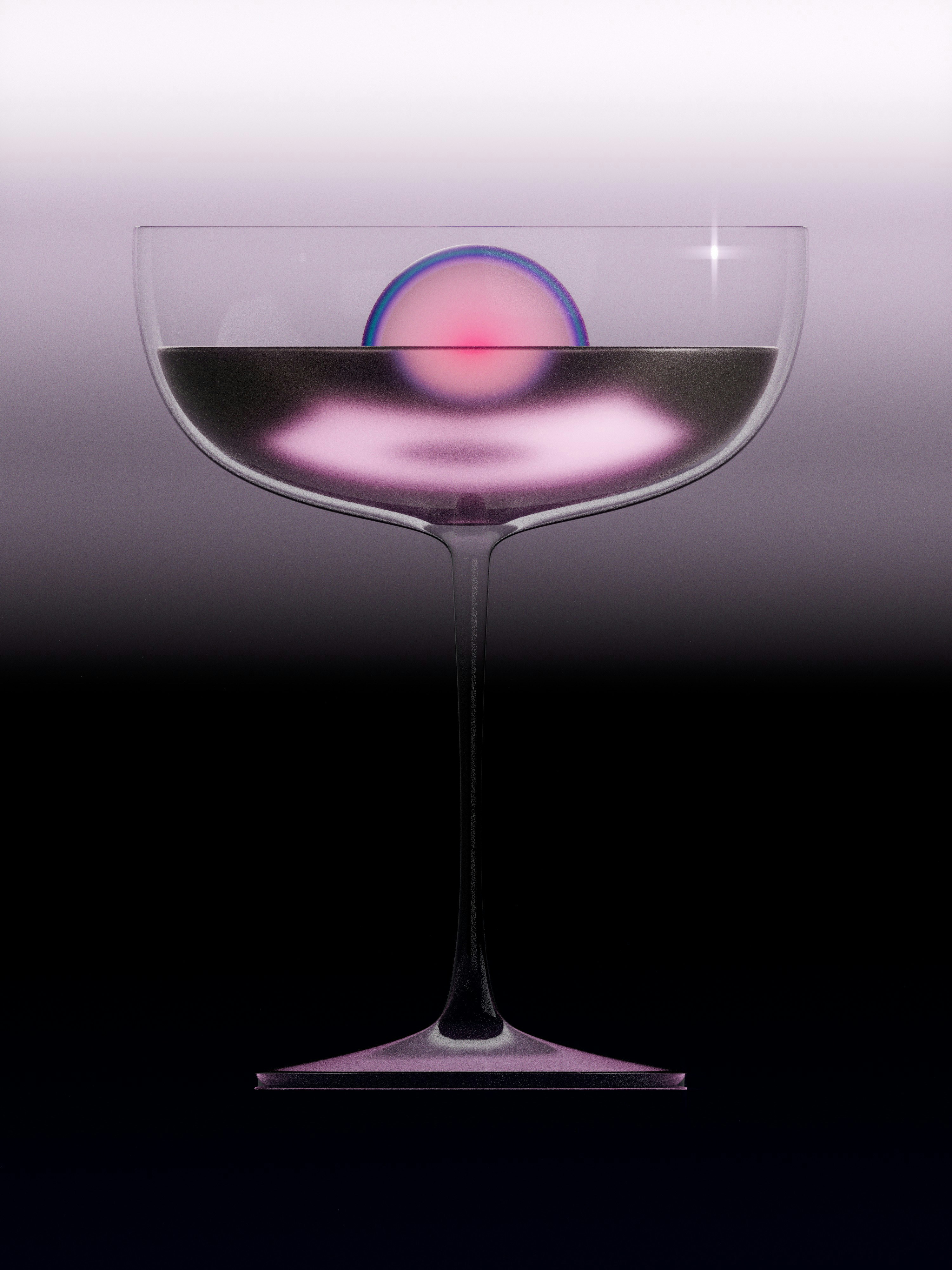 A cocktail glass containing dark liquid and a glowing pink sphere