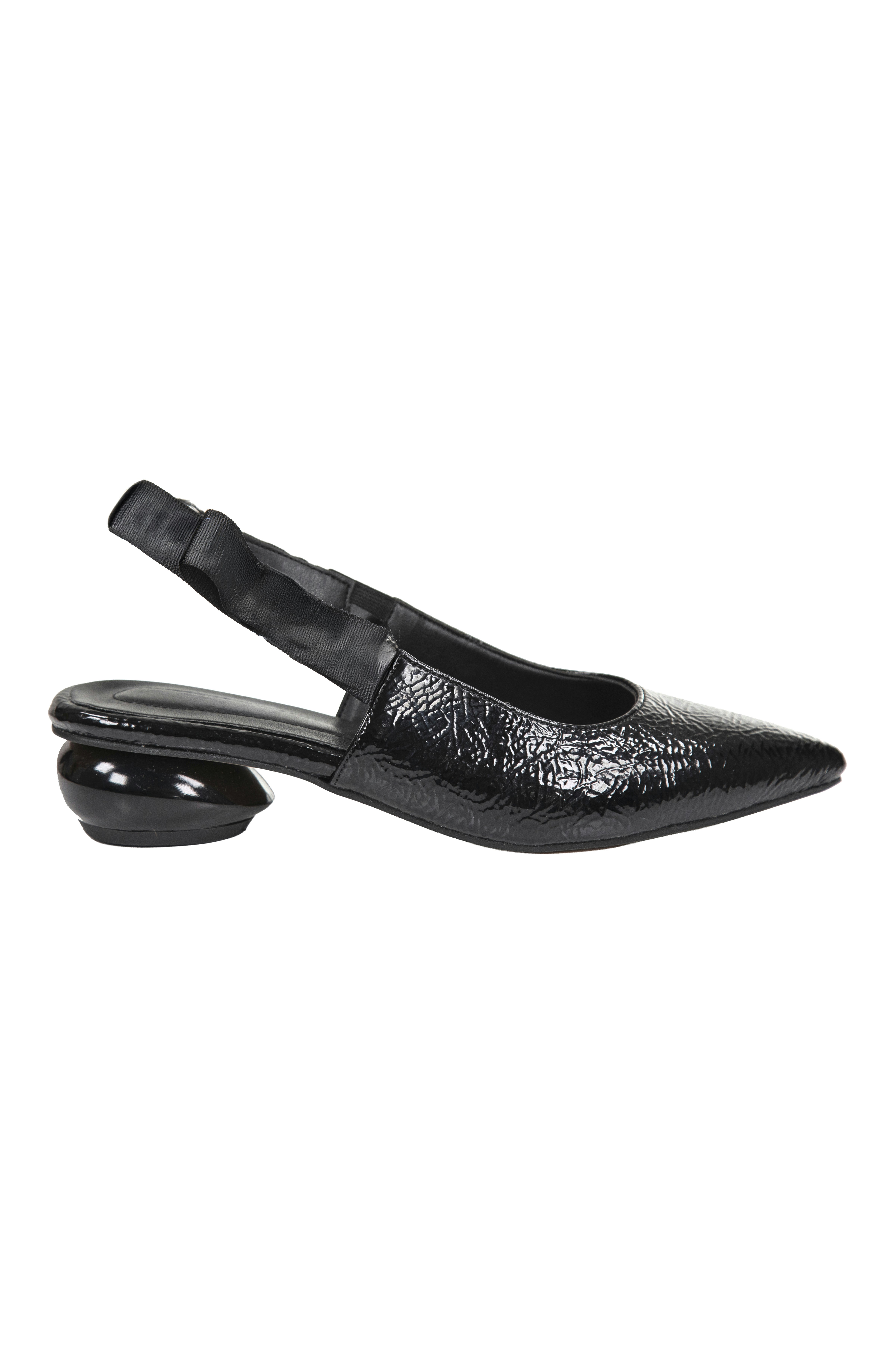A black patent leather slingback shoe with a rounded heel on white