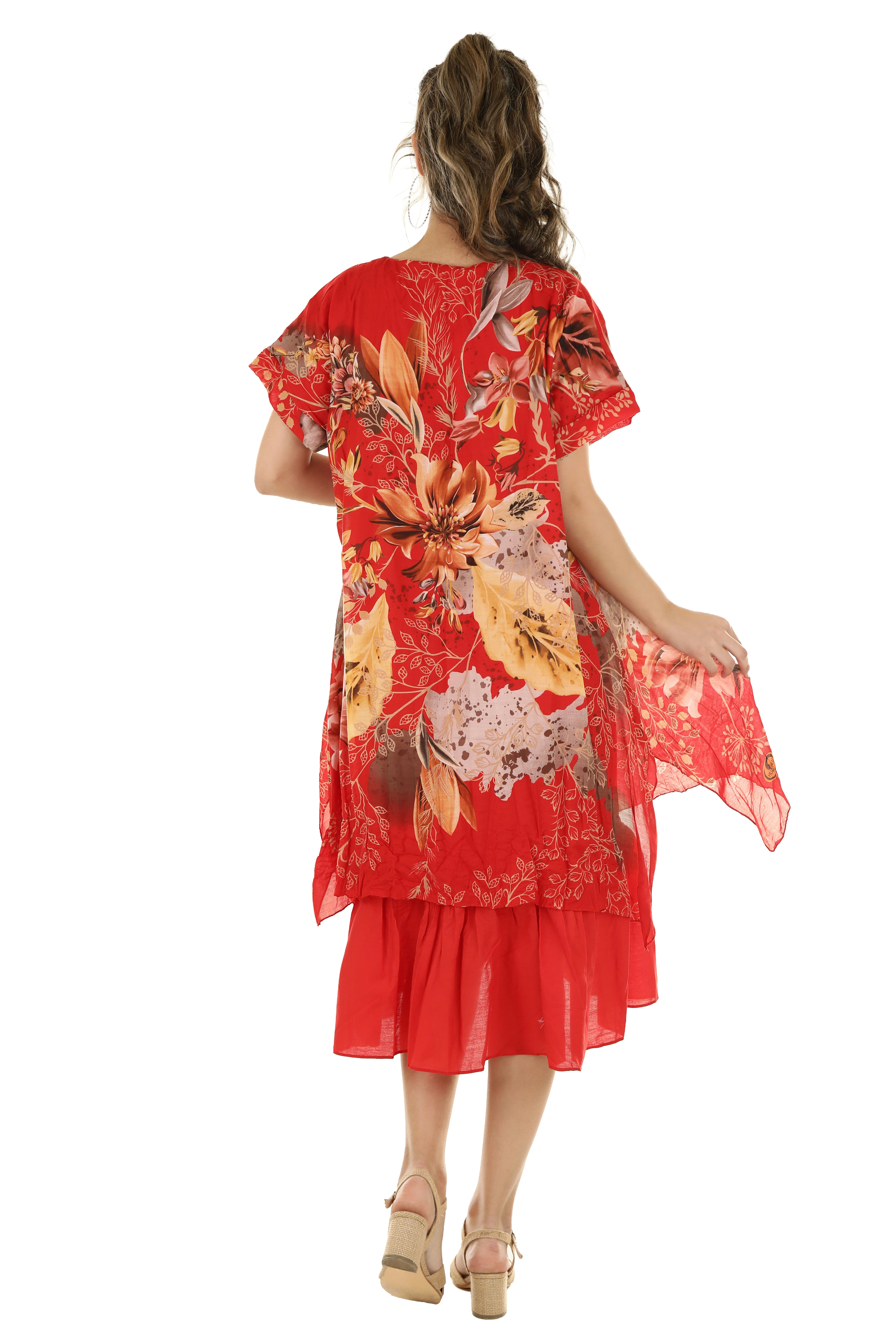 A woman seen from behind wearing a red floral tunic and skirt