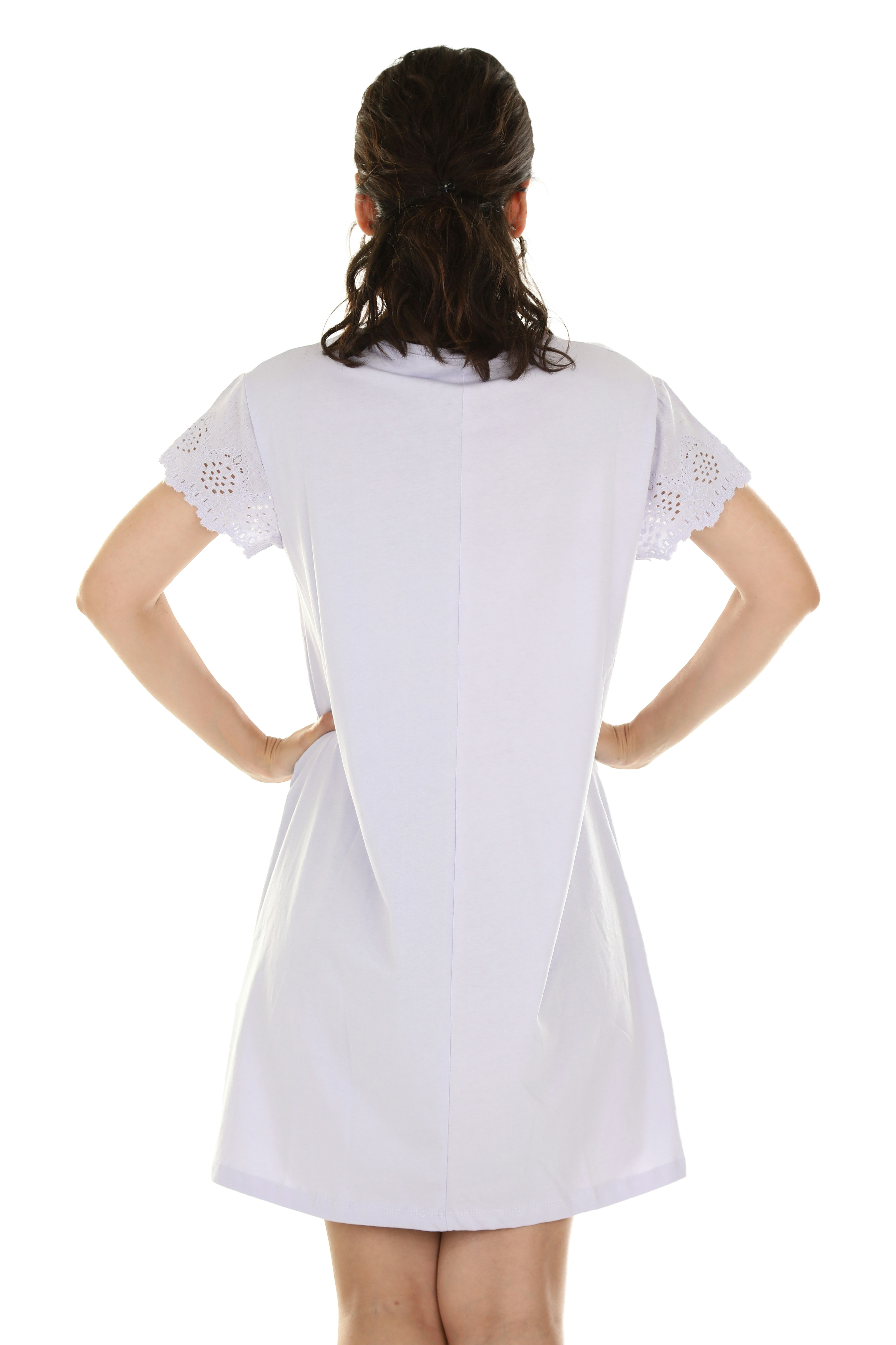 A woman from behind wearing a white dress with eyelet lace sleeves