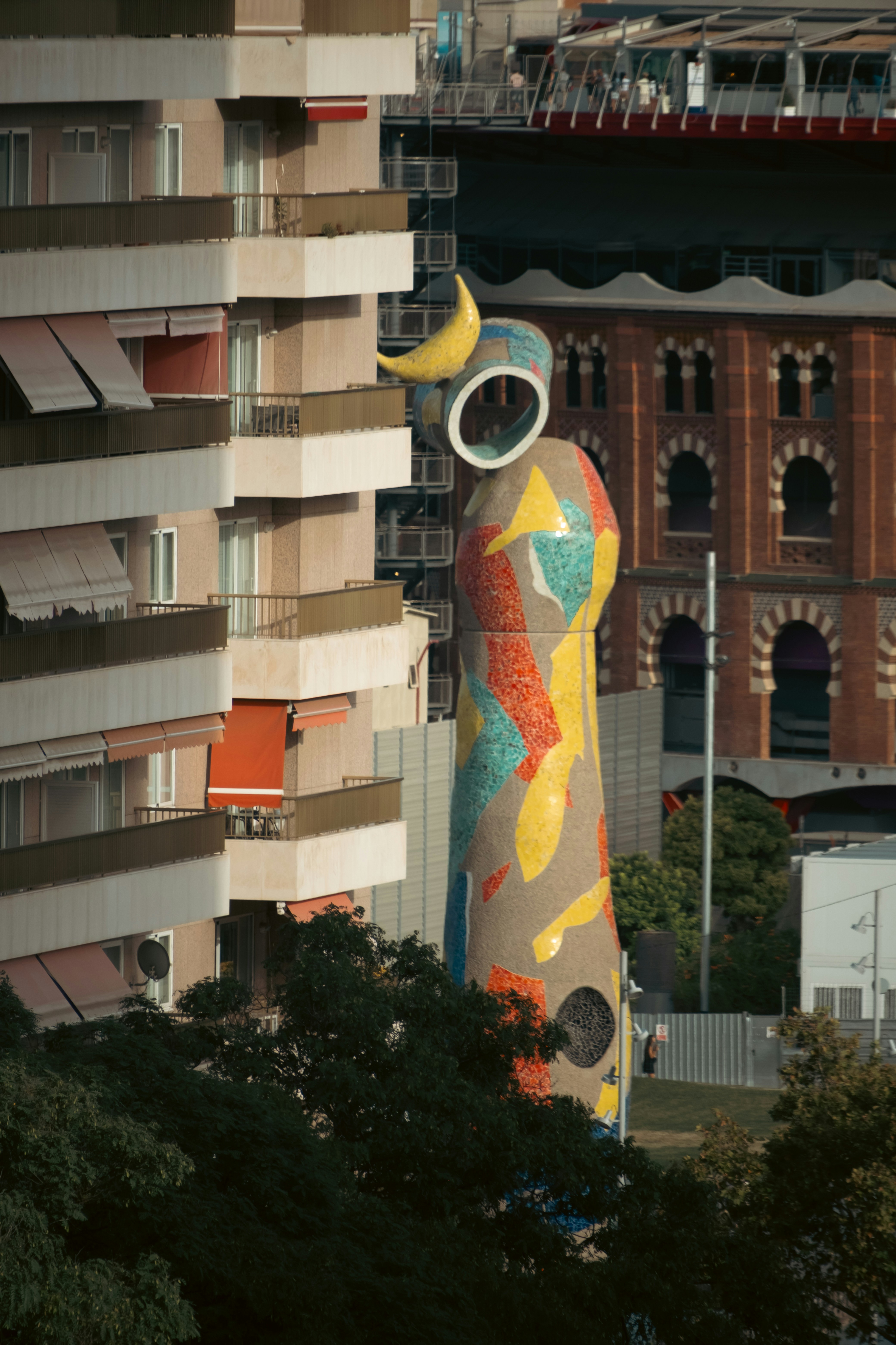 The Dona i Ocell sculpture by Joan Miró in Barcelona near a residential building