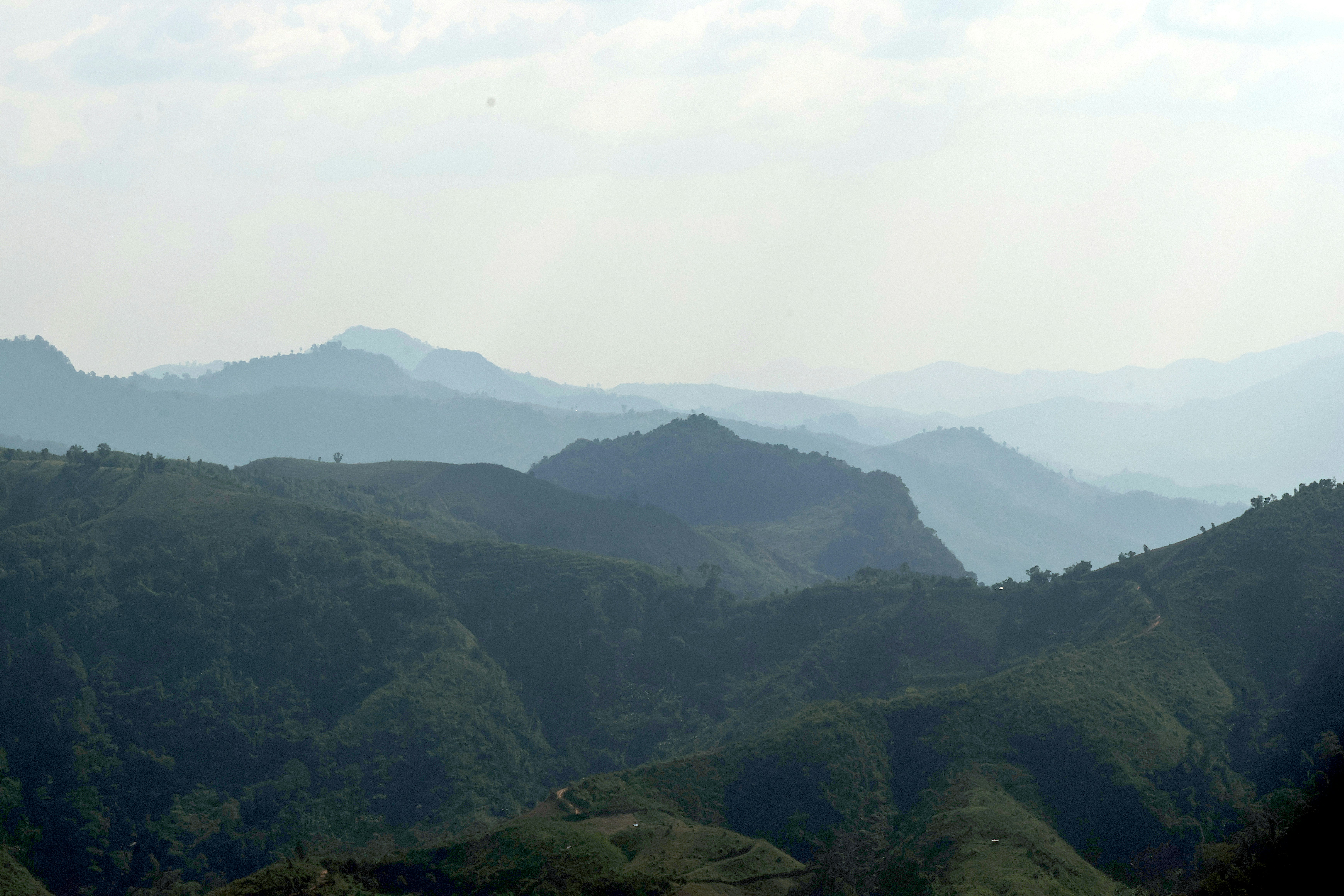 Green mountain ridges in haze - Free Photo on Unsplash