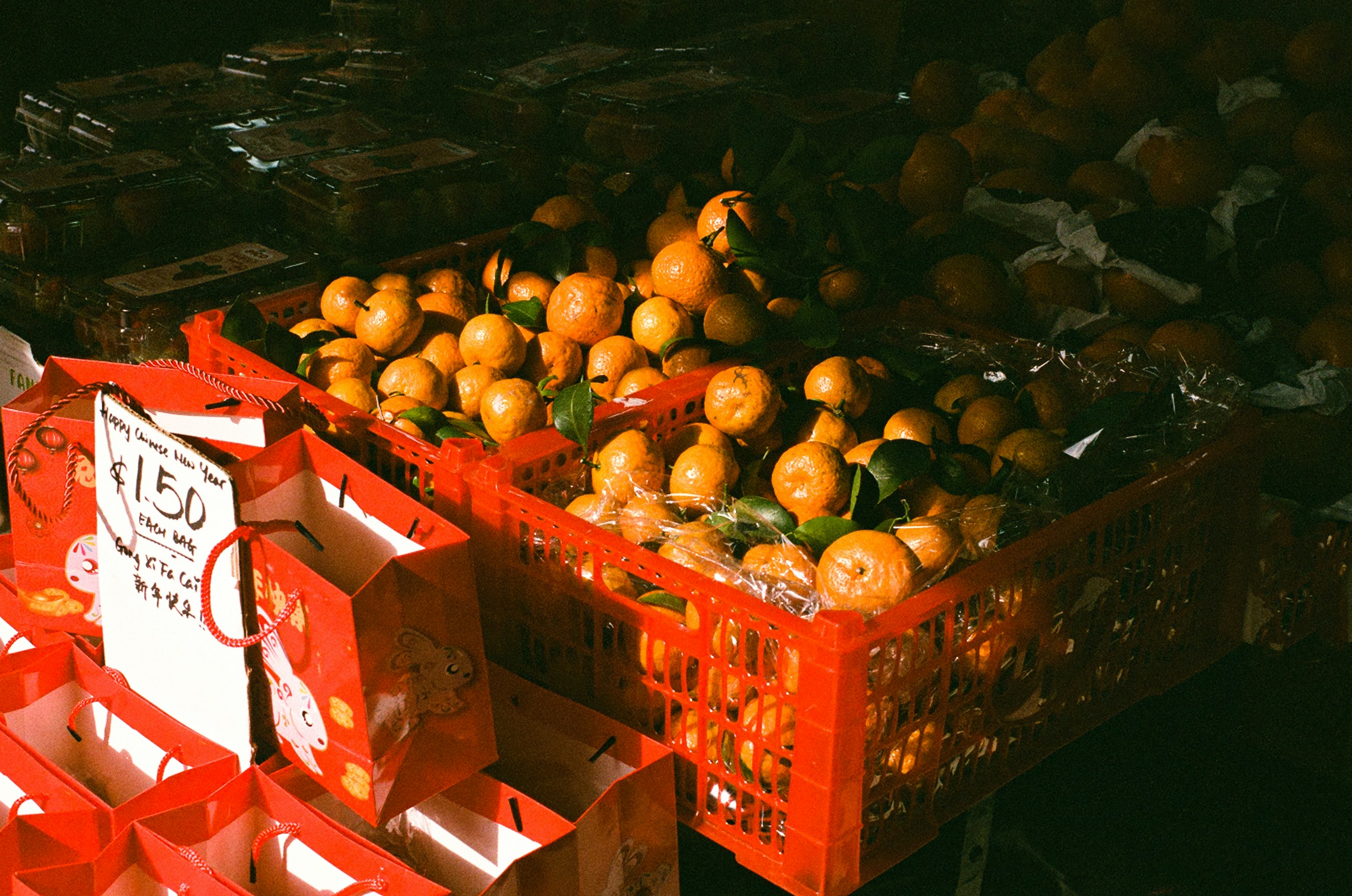 Mandarins in red crates