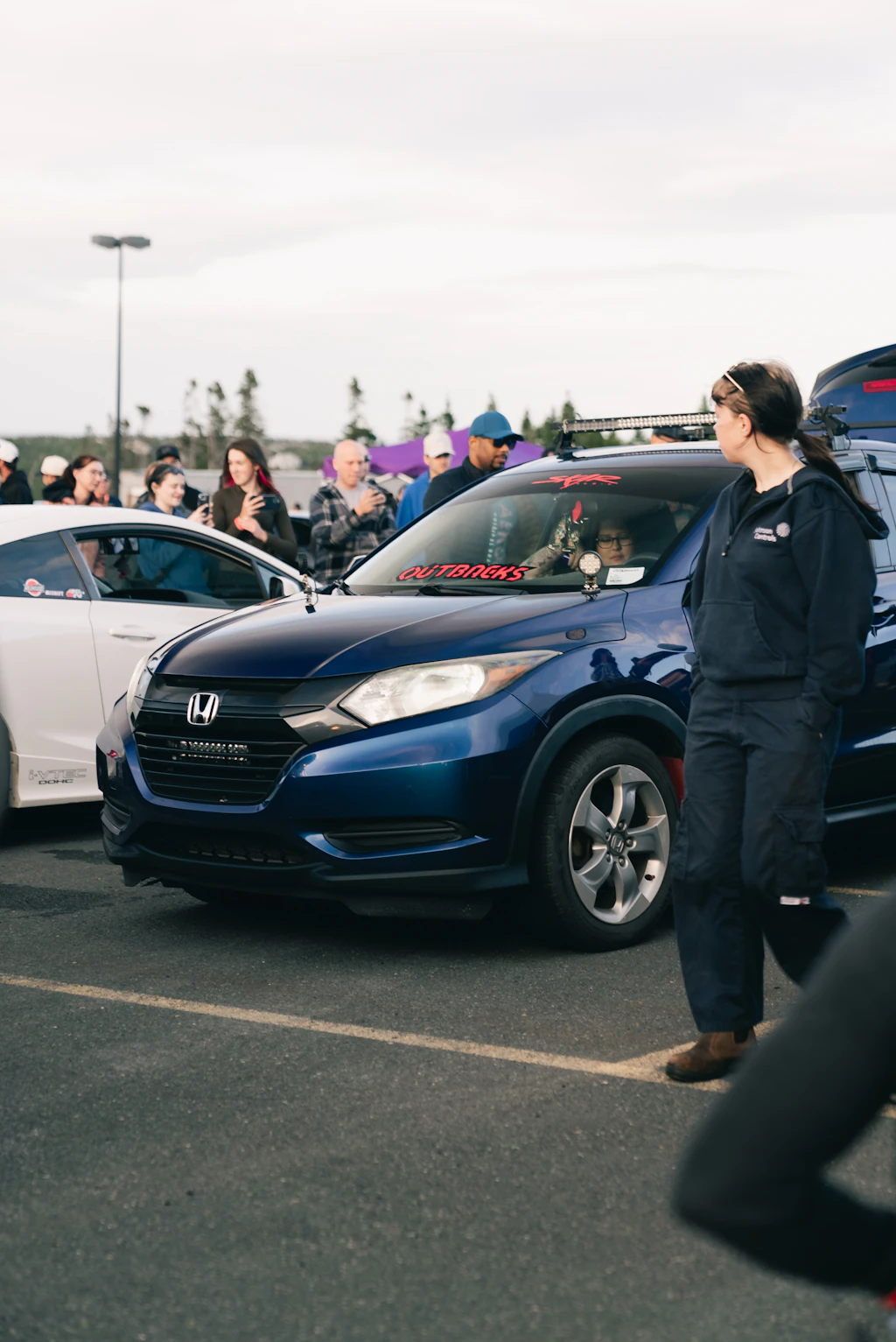 A blue Honda SUV parked in a lot