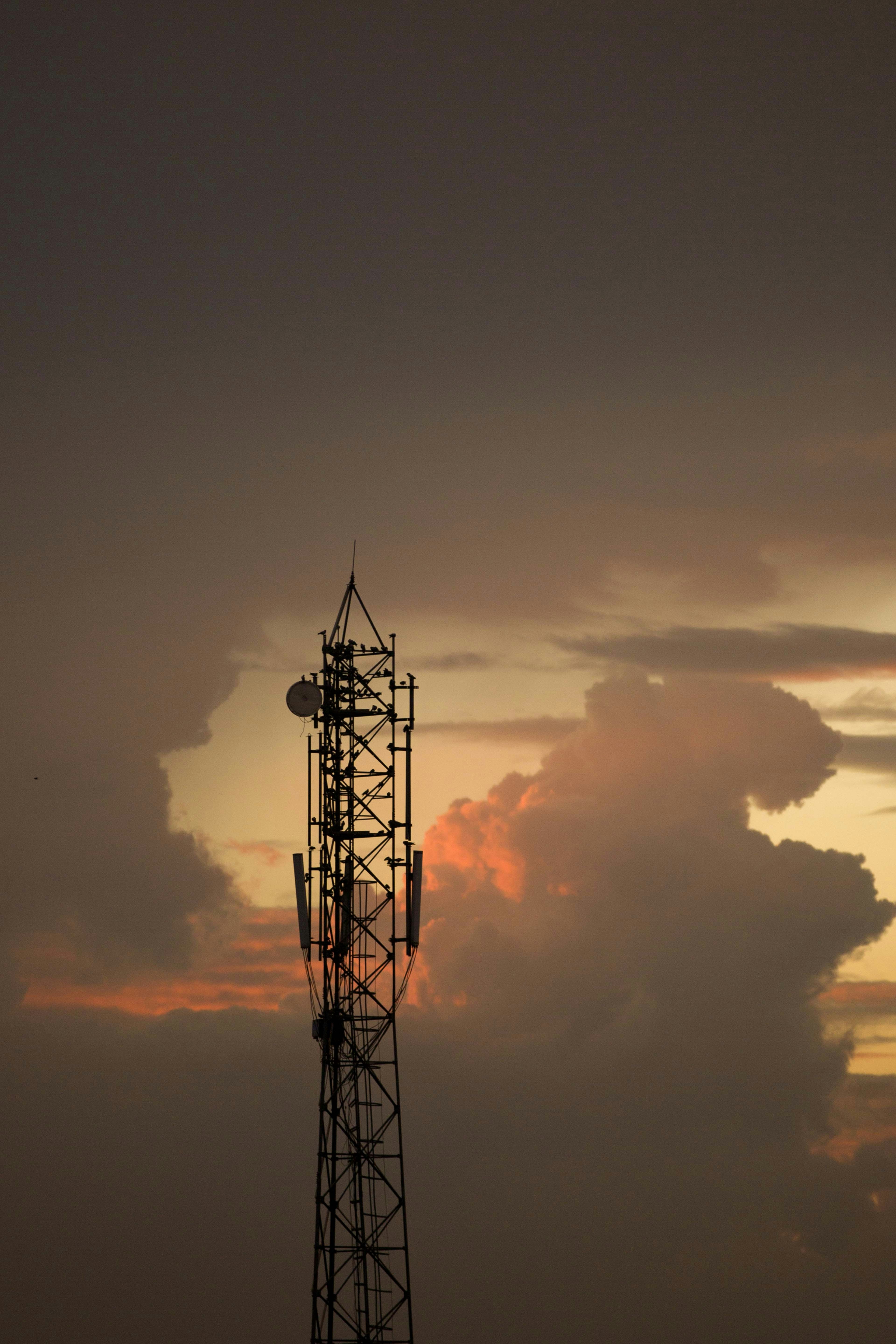 Telecom tower against the sky, representing OFC infrastructure deployment