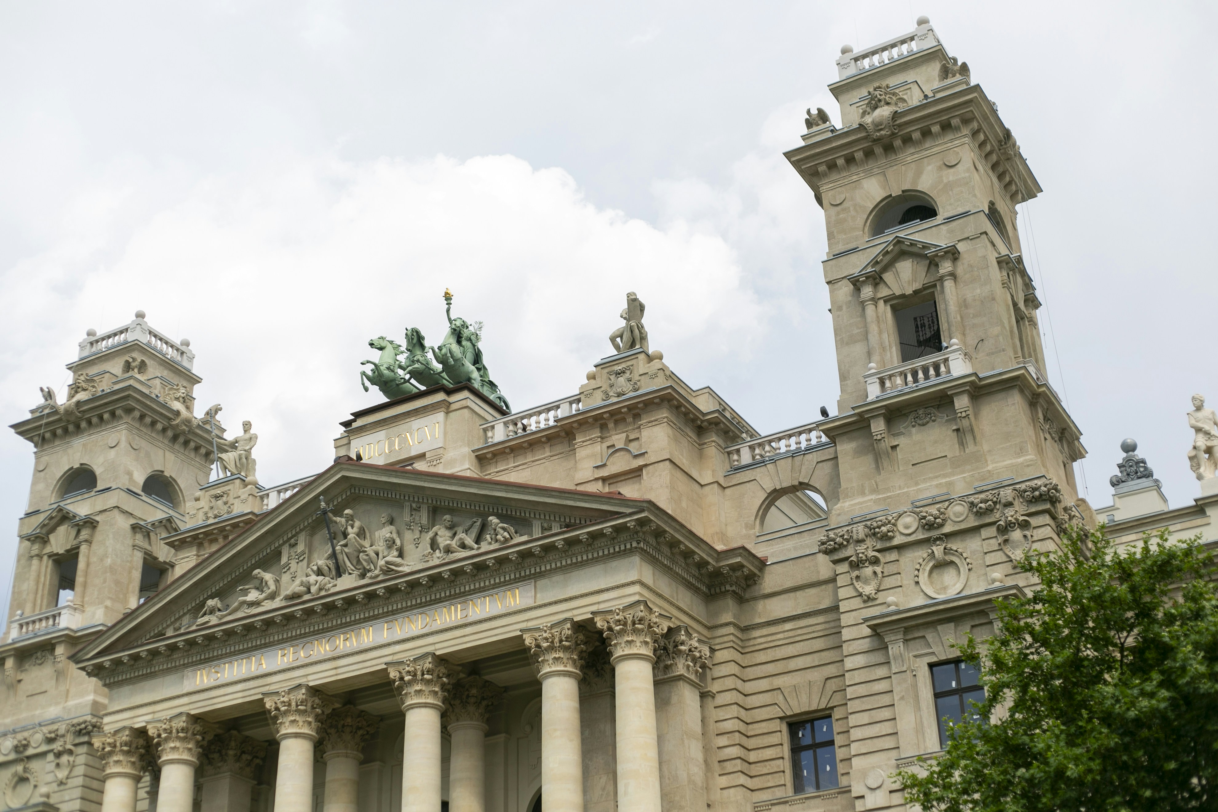 The Hungarian Academy of Sciences building with neoclassical architecture and a green chariot sculpture