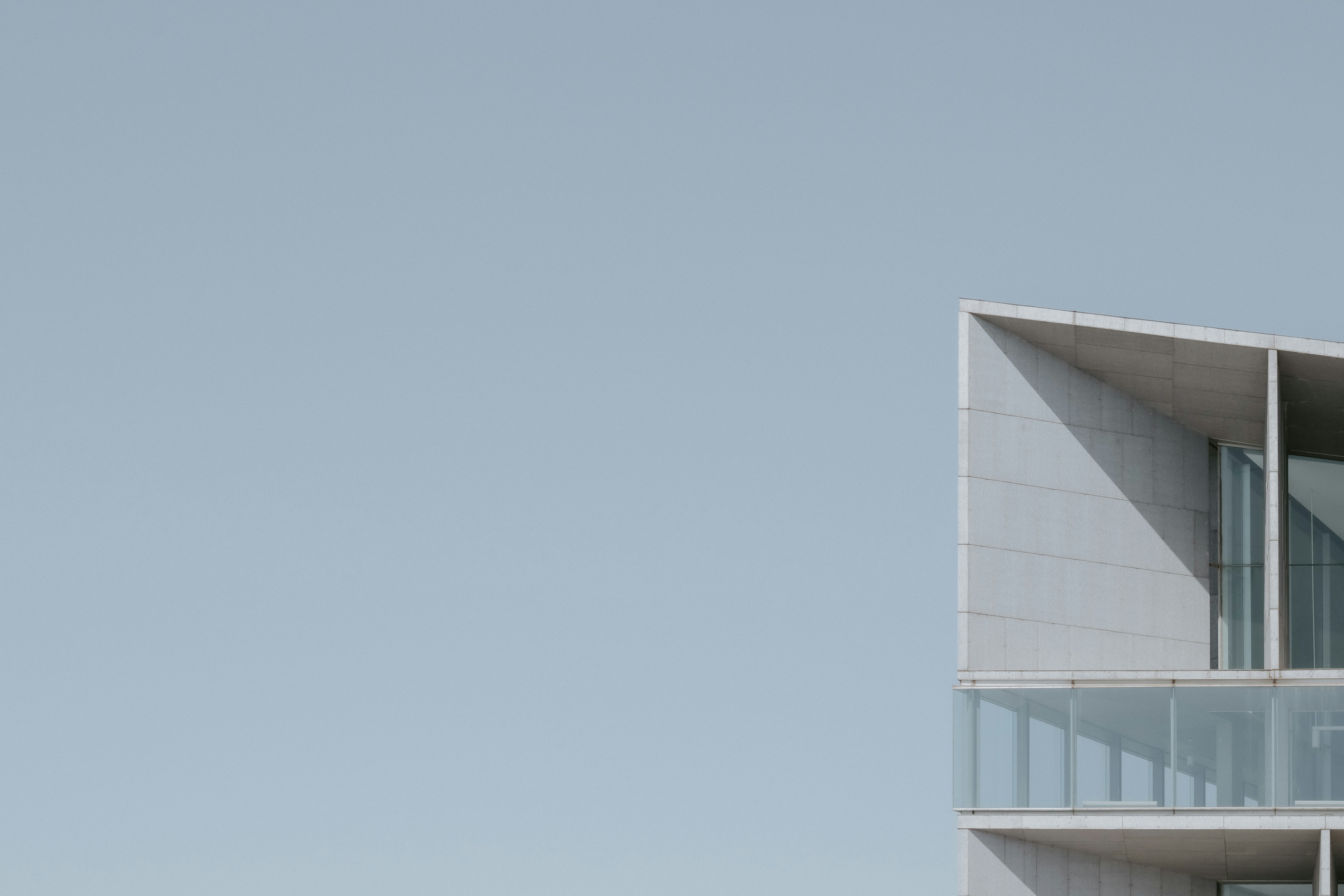 Corner of a Modern Concrete Building Against a Clear