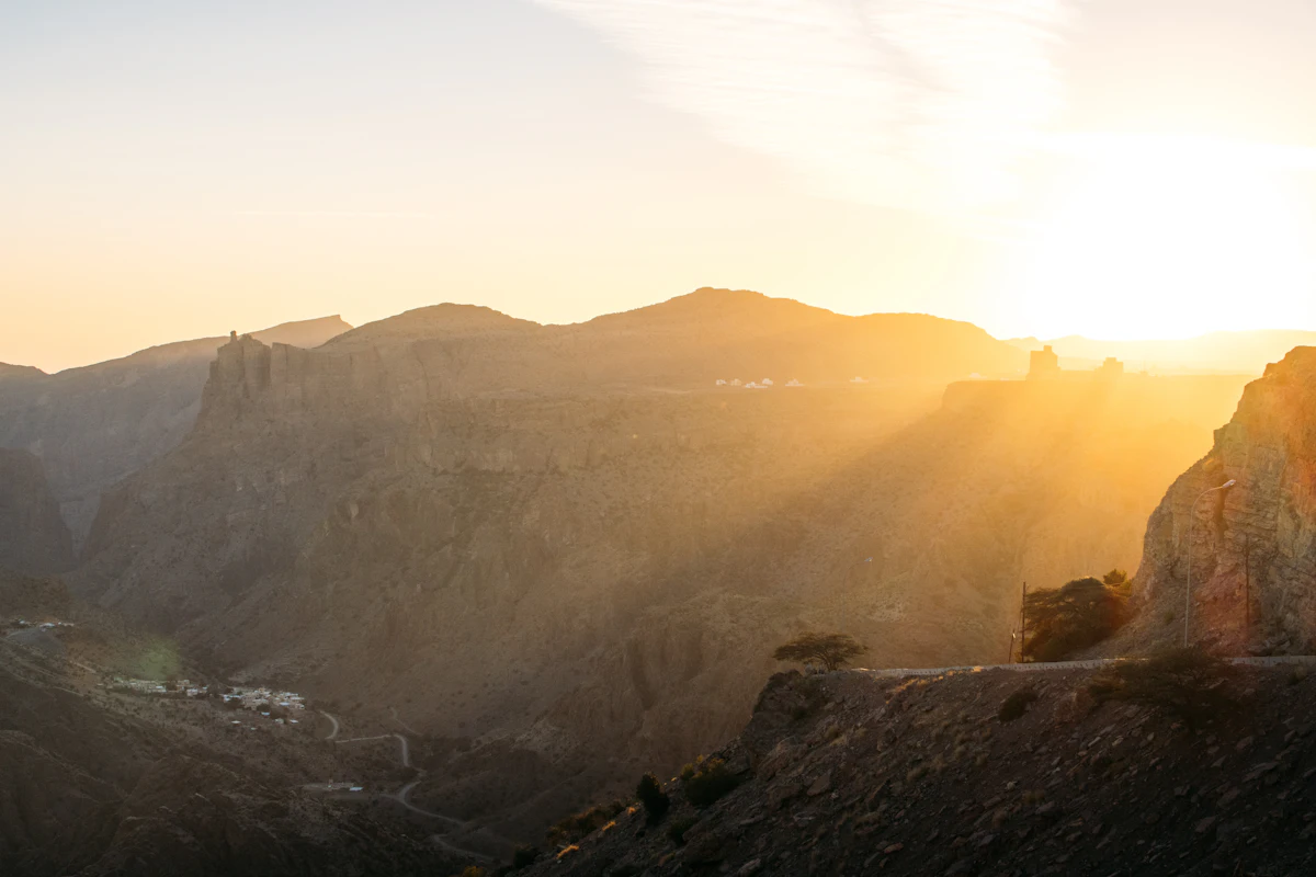 Low sun over a deep canyon and rocky cliffs on Jebel Akhdar