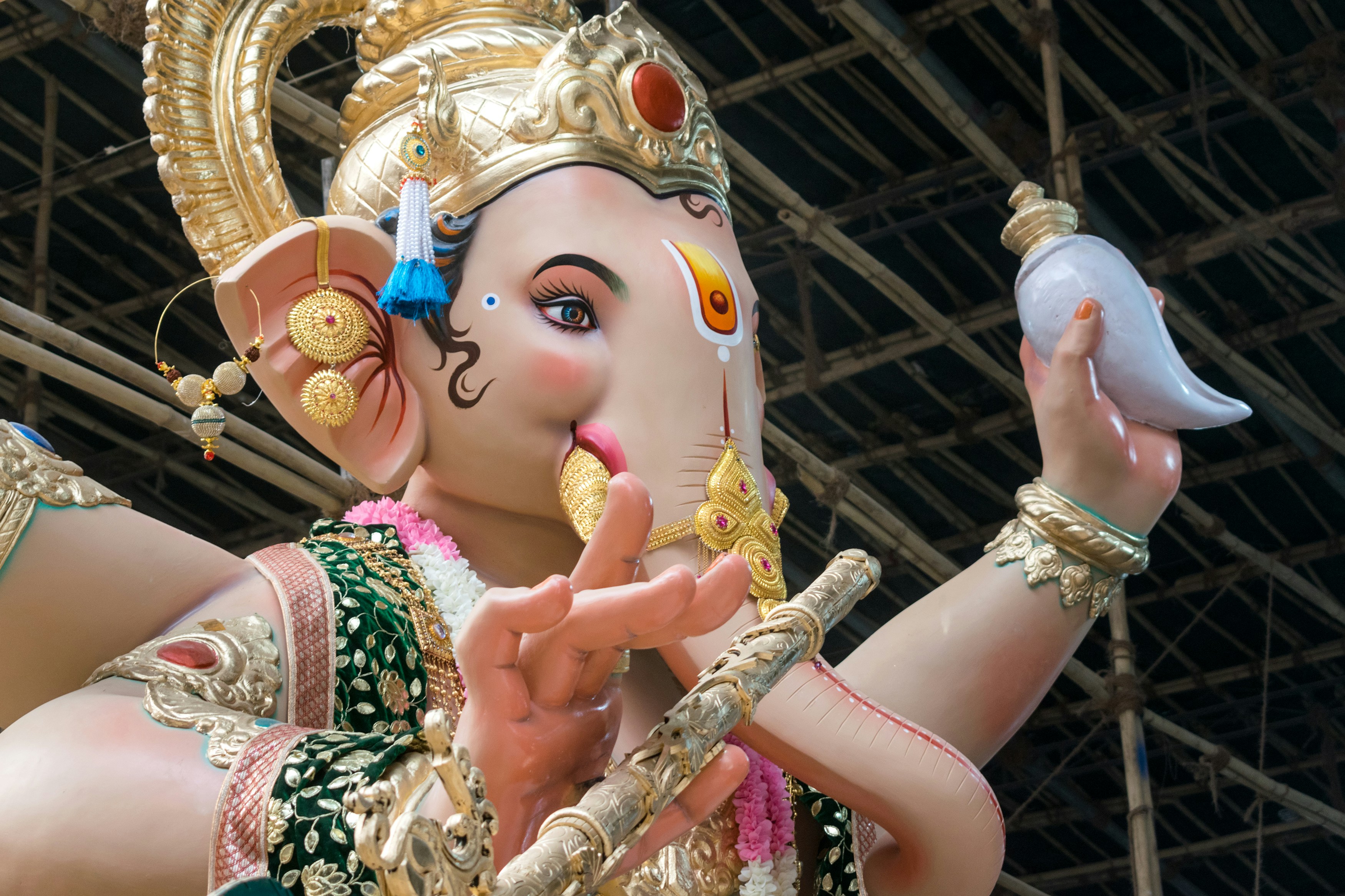 A large ornate statue of Lord Ganesha holding a conch in Mumbai