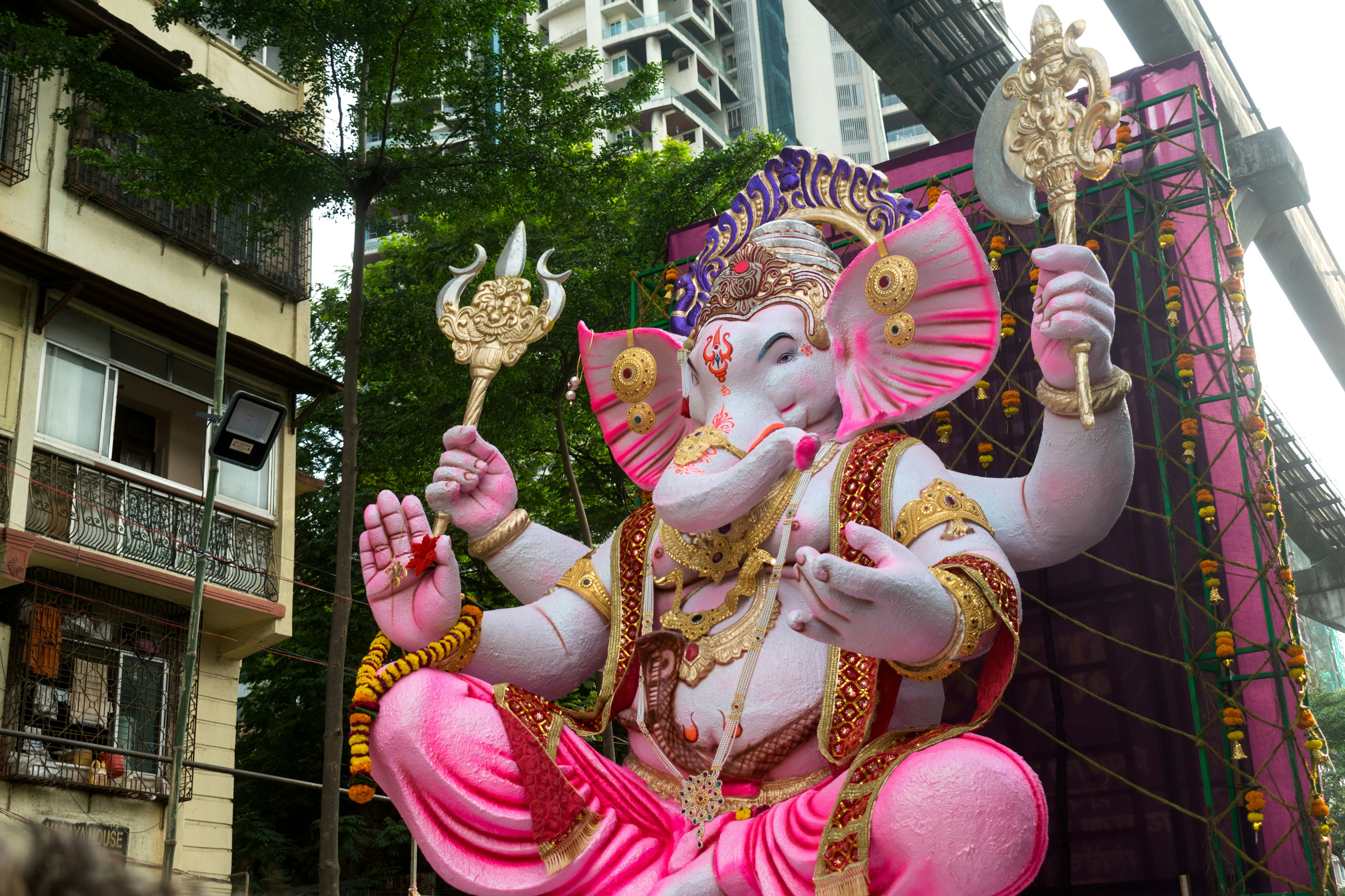 A large statue of Lord Ganesha in Mumbai, India, during a street procession