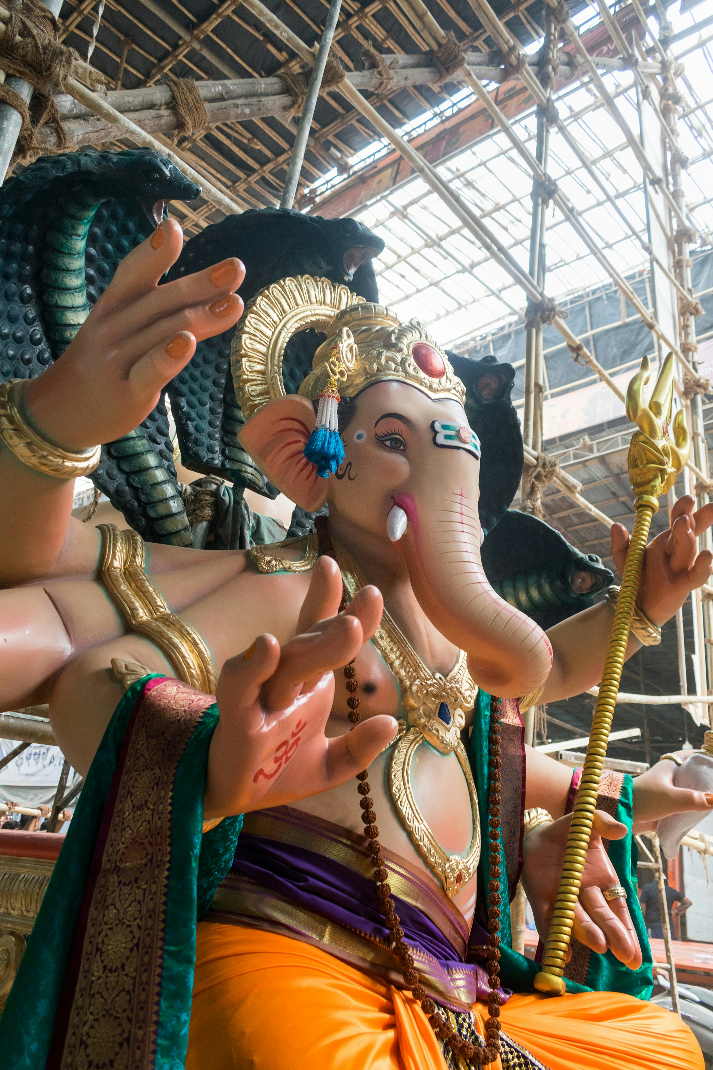 A large statue of Lord Ganesha with multiple arms in Mumbai, India