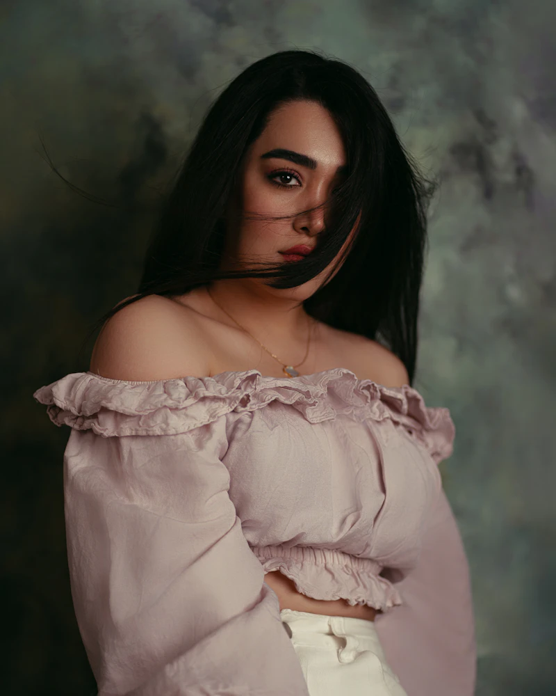 Painterly portrait with hair falling over the face