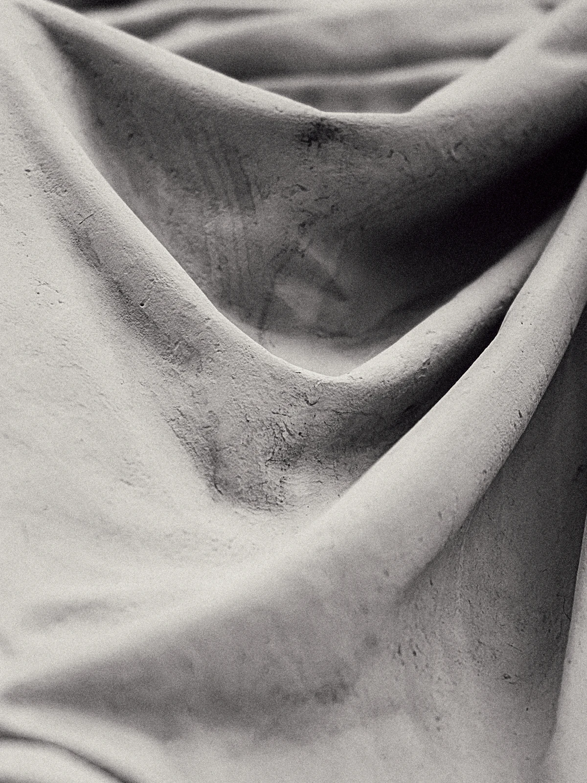 Close study of grey drapery folds