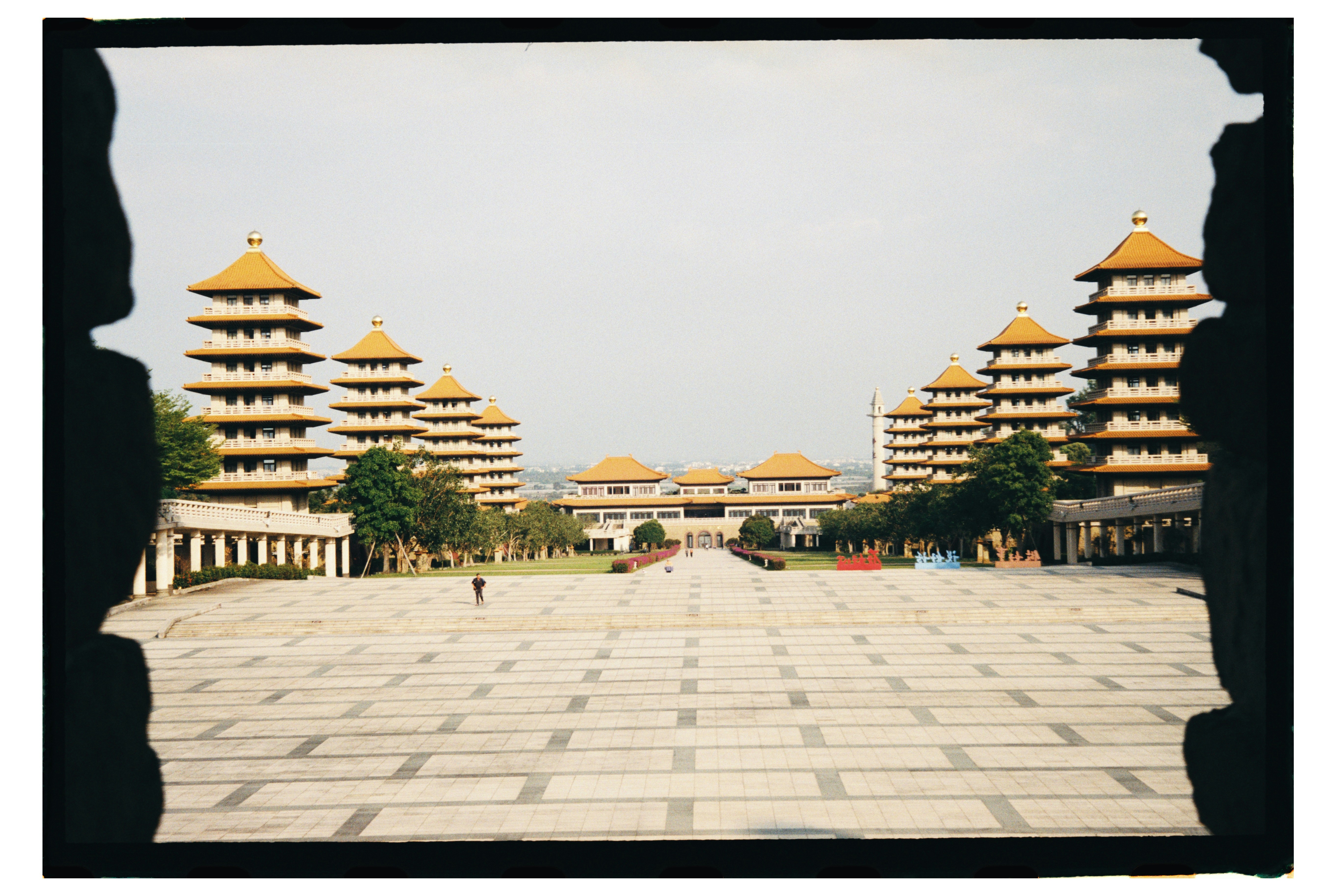 Pagodas flanking a large paved courtyard at the Fo Guang Shan Buddha Museum