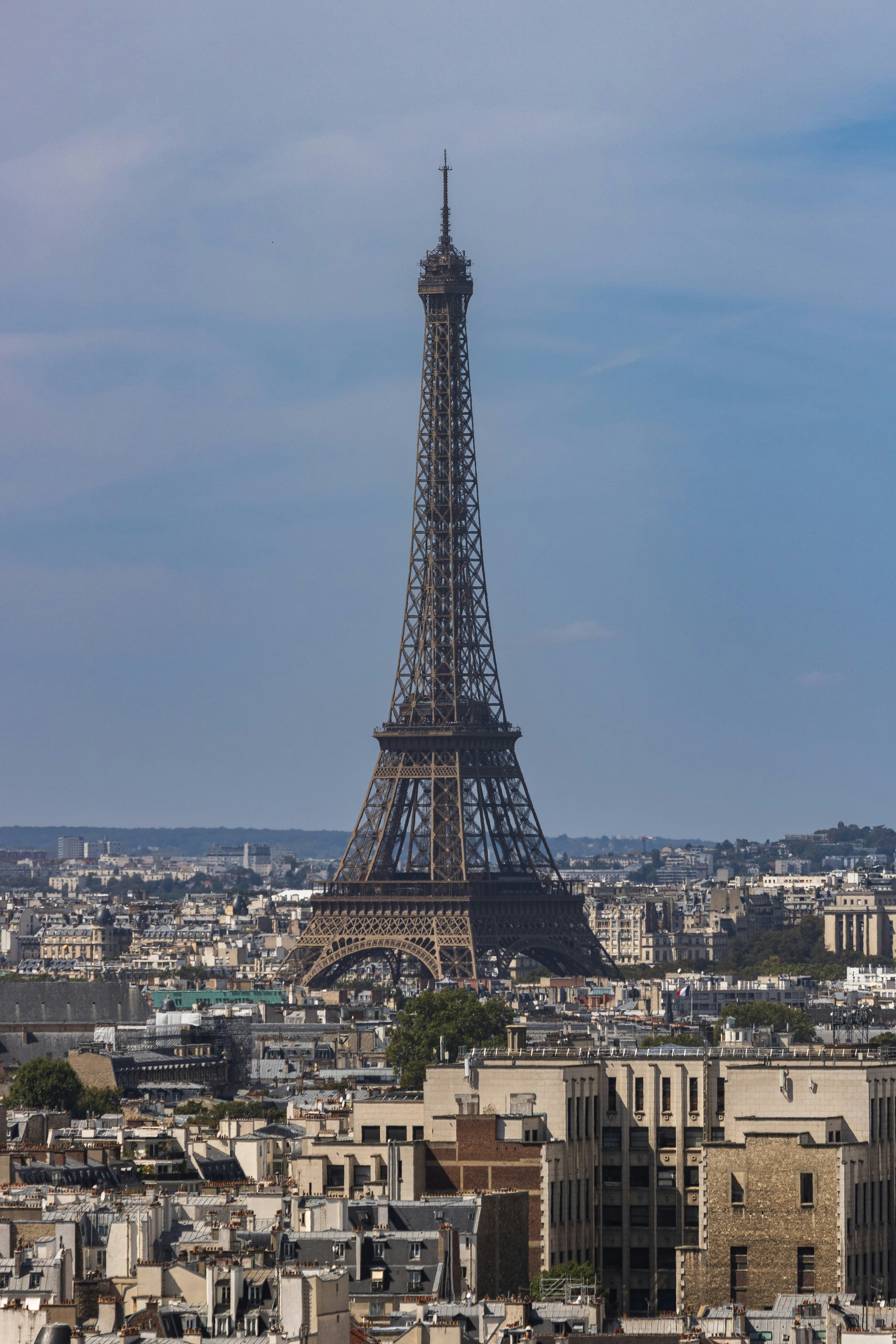 The Eiffel Tower rising above the dense urban skyline of Paris