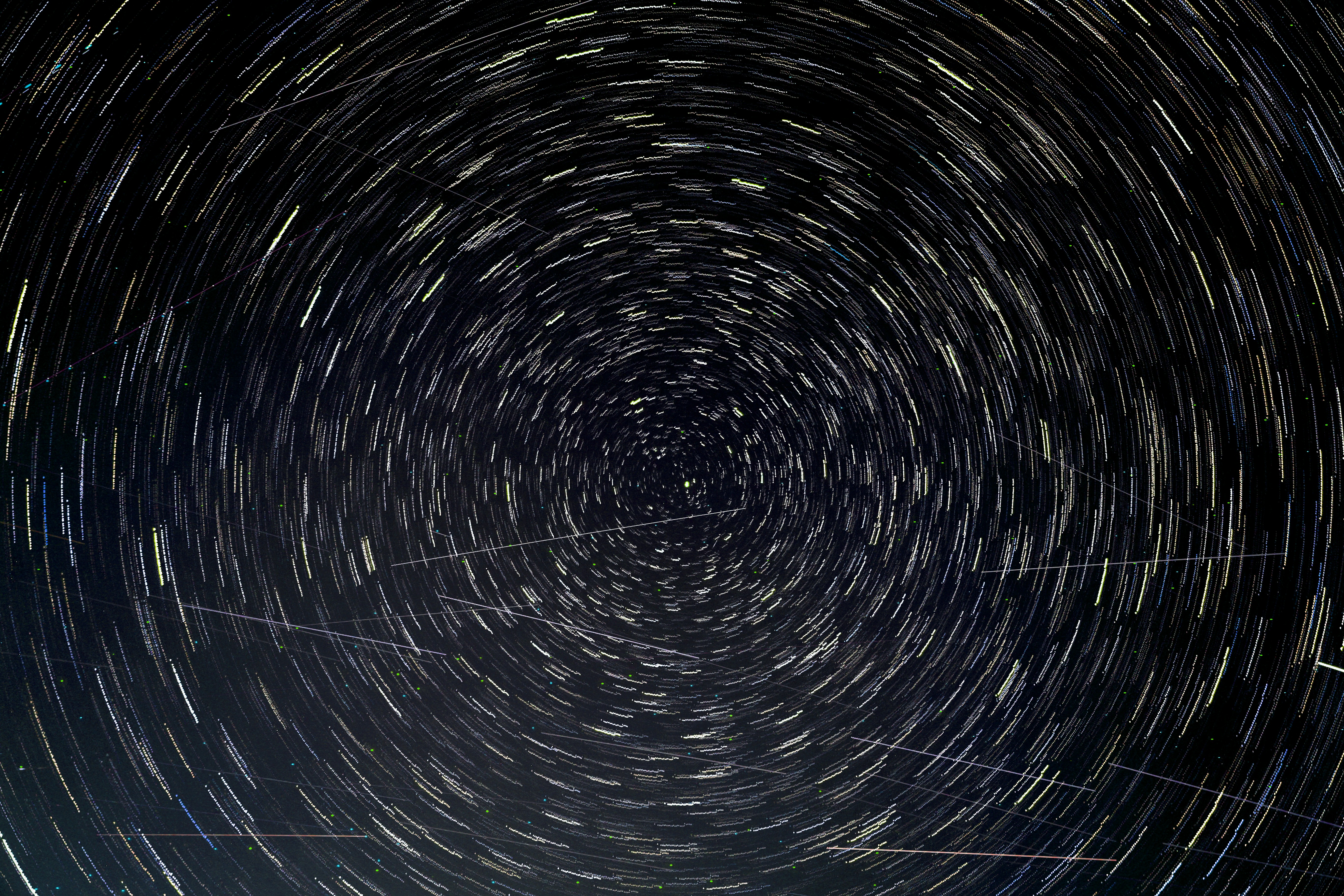 Circular star trails rotating around a central point in the night sky