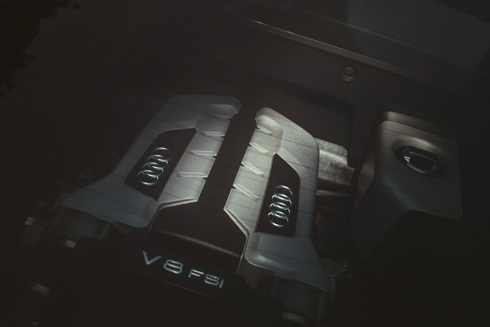 A V8 engine in a dark engine bay