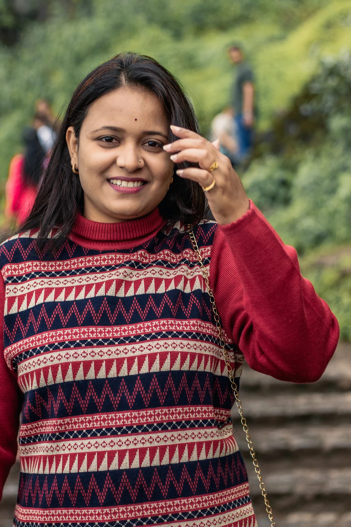 A smiling young woman outdoors