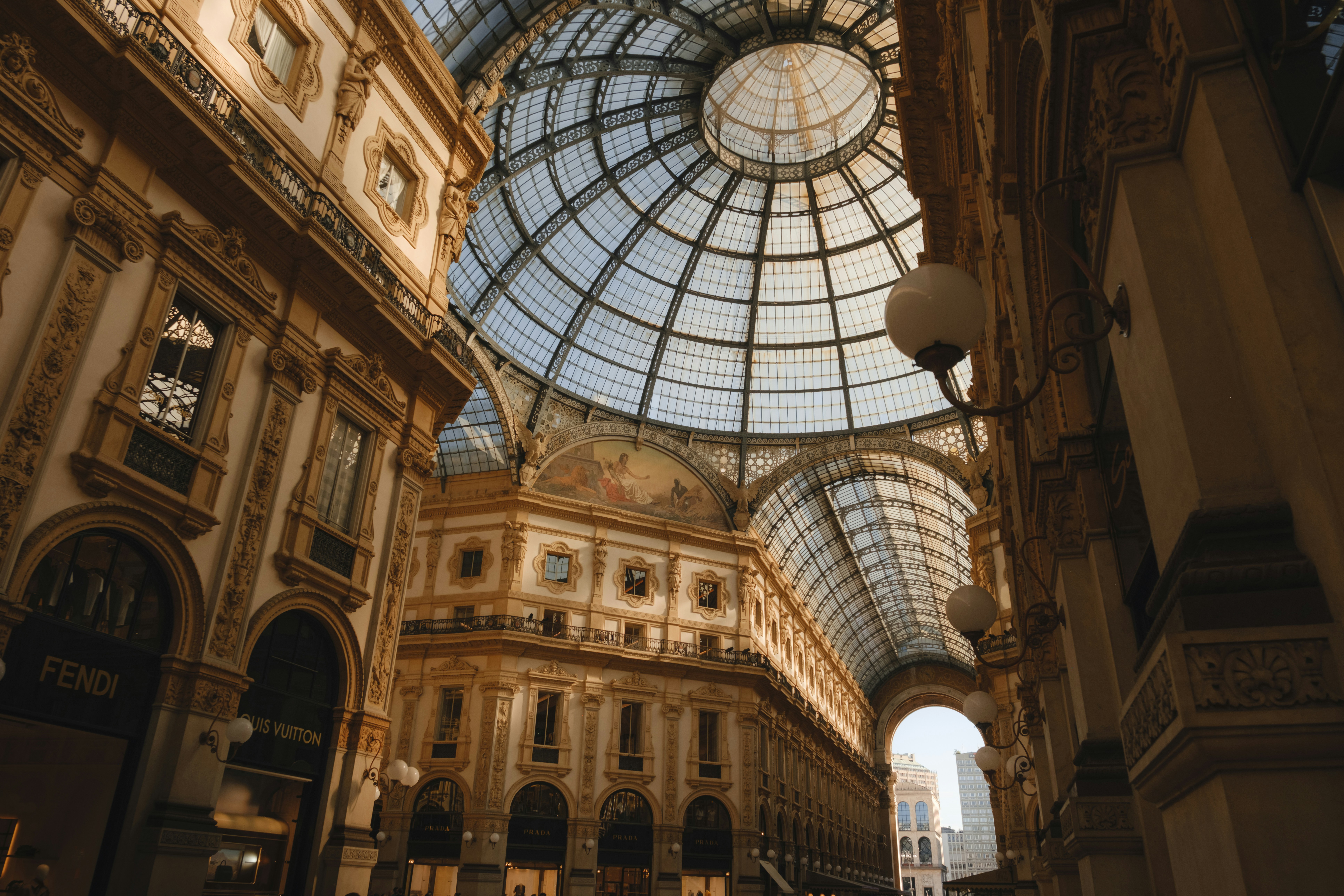 The glass dome and ornate architecture of the Galleria Vittorio Emanuele II in Milan