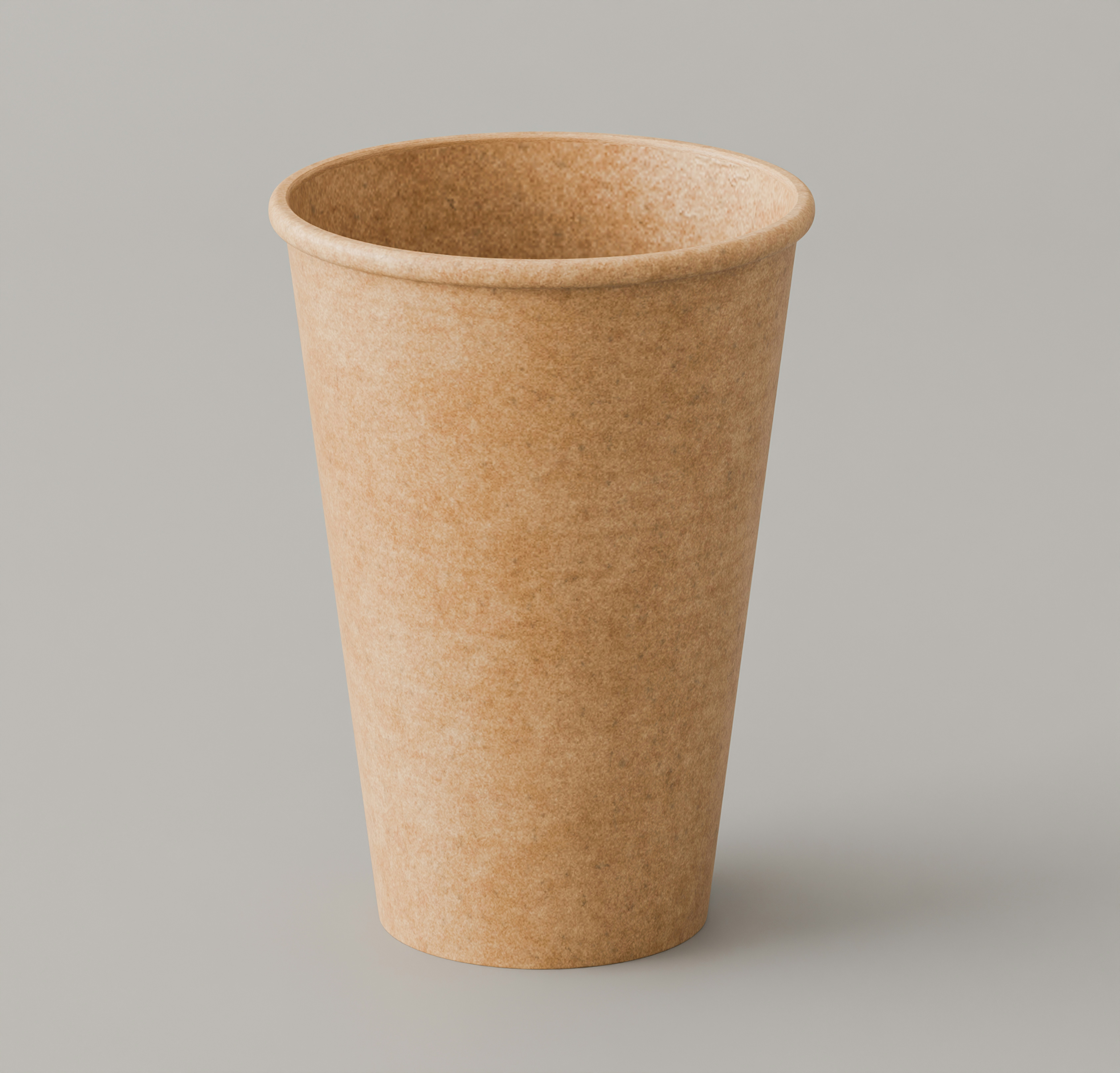 A brown paper cup on a plain grey background
