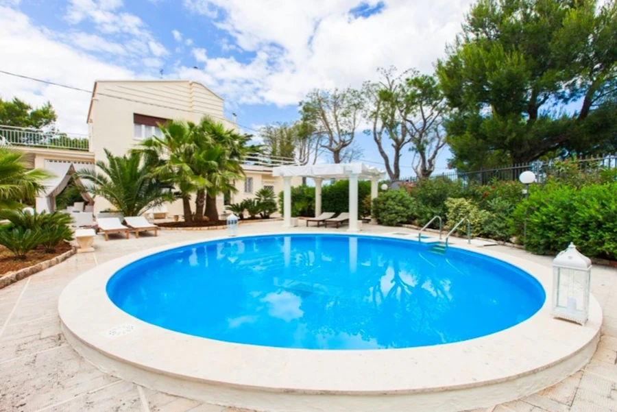 Pergola beside a villa pool