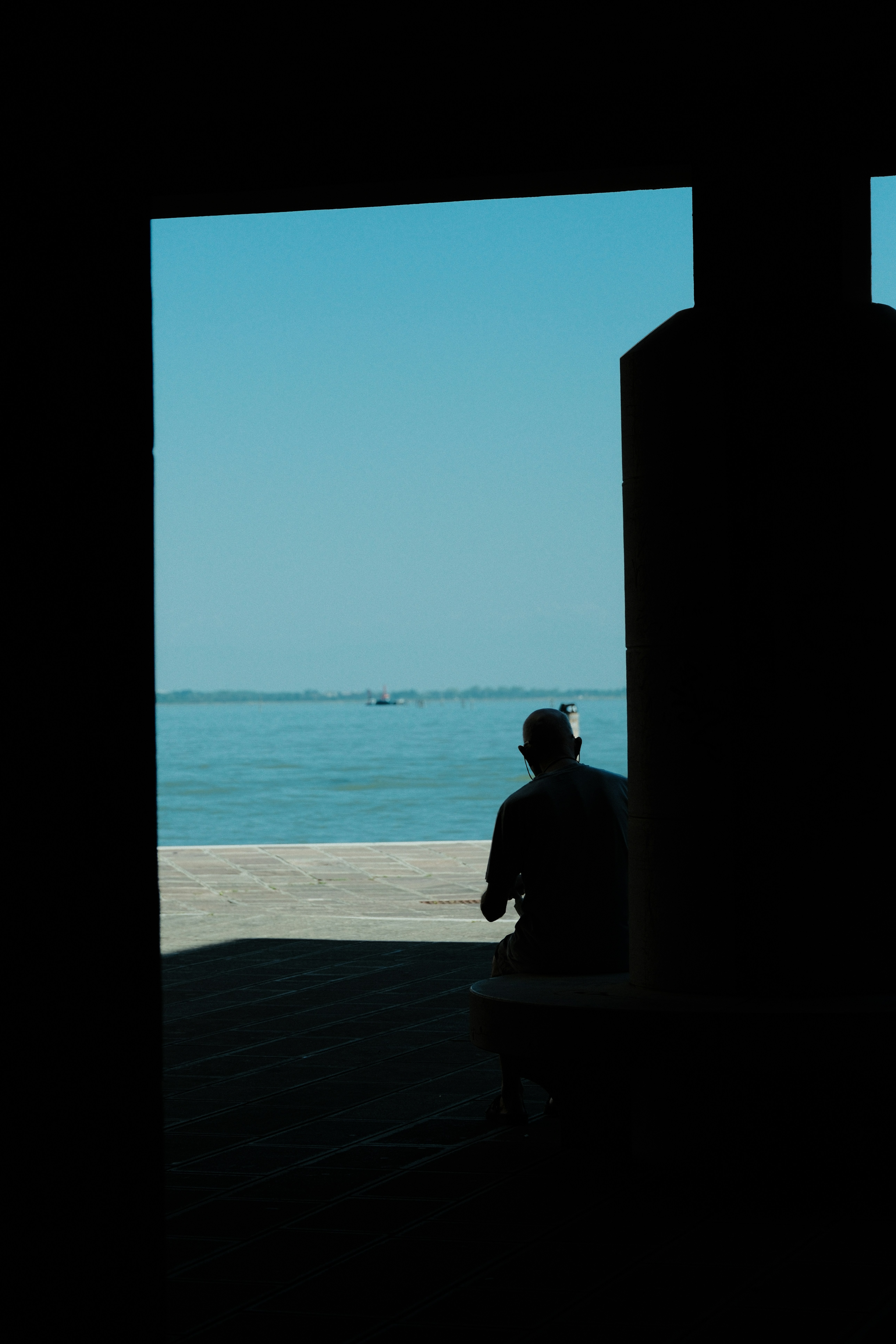 Person in silhouette overlooking sea - Free Photo on Unsplash