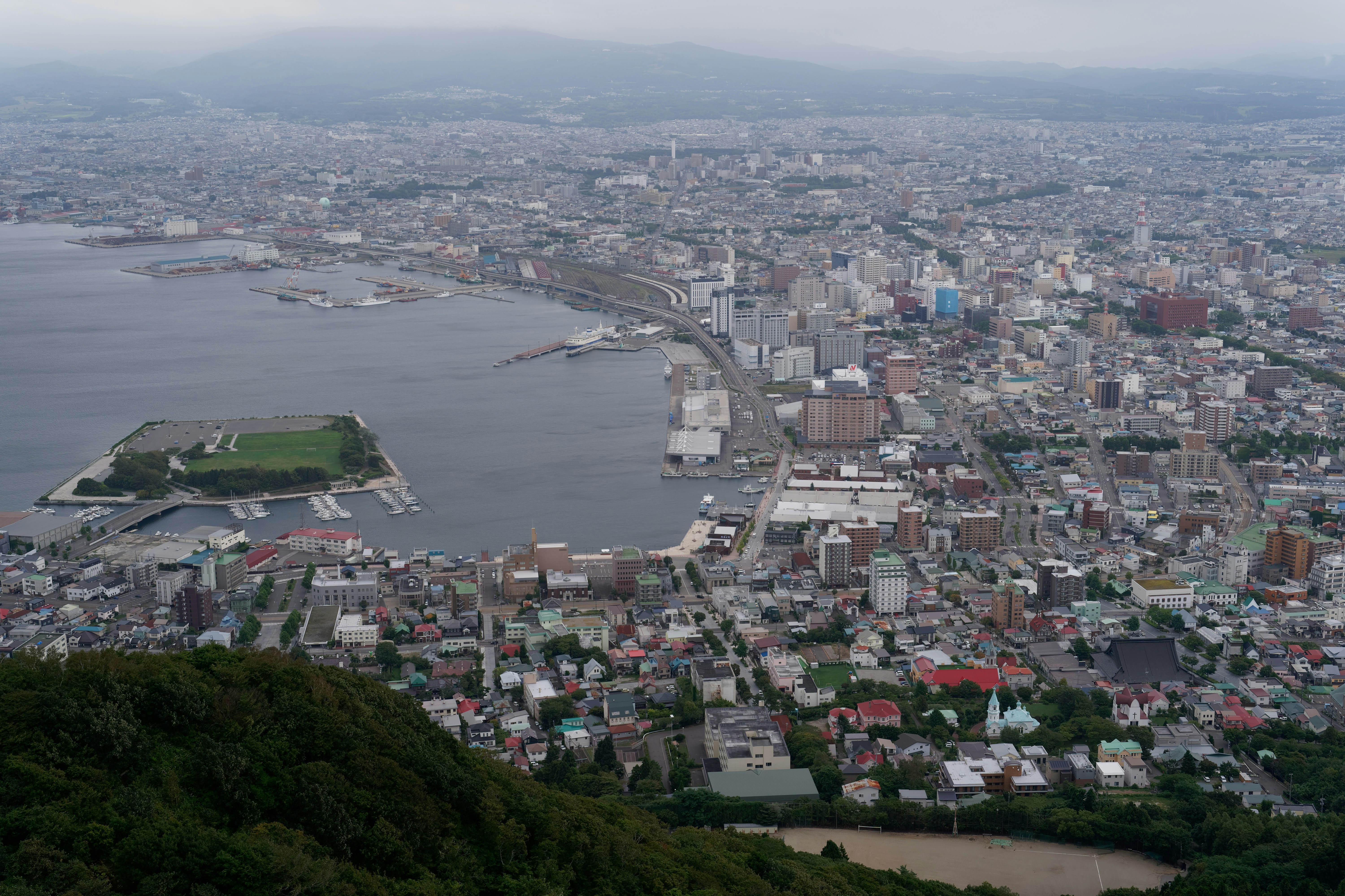 Aerial view of the coastal city of Hakodate with its harbor and urban sprawl