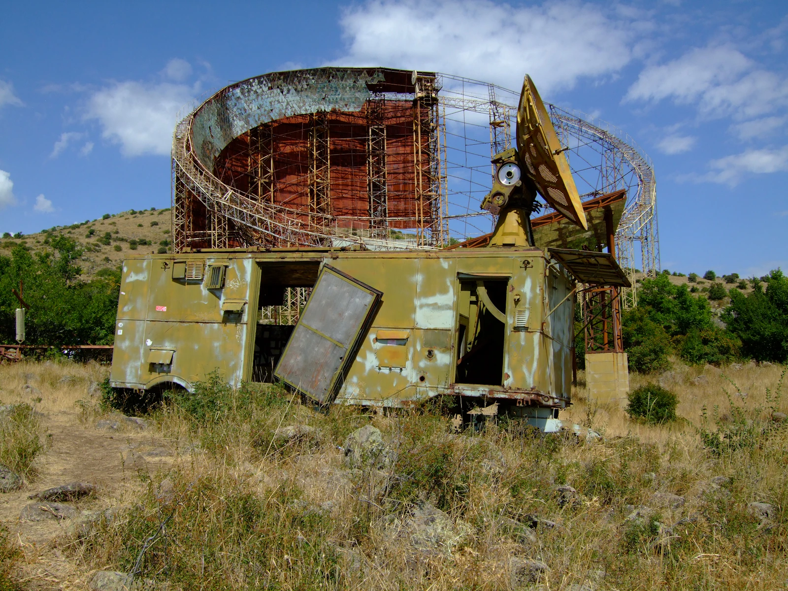 An abandoned, rusted radar installation in an overgrown field, representing the International Targeting report Search Console retired in 2022, a monitoring tool that once flagged hreflang errors directly and now sits decommissioned