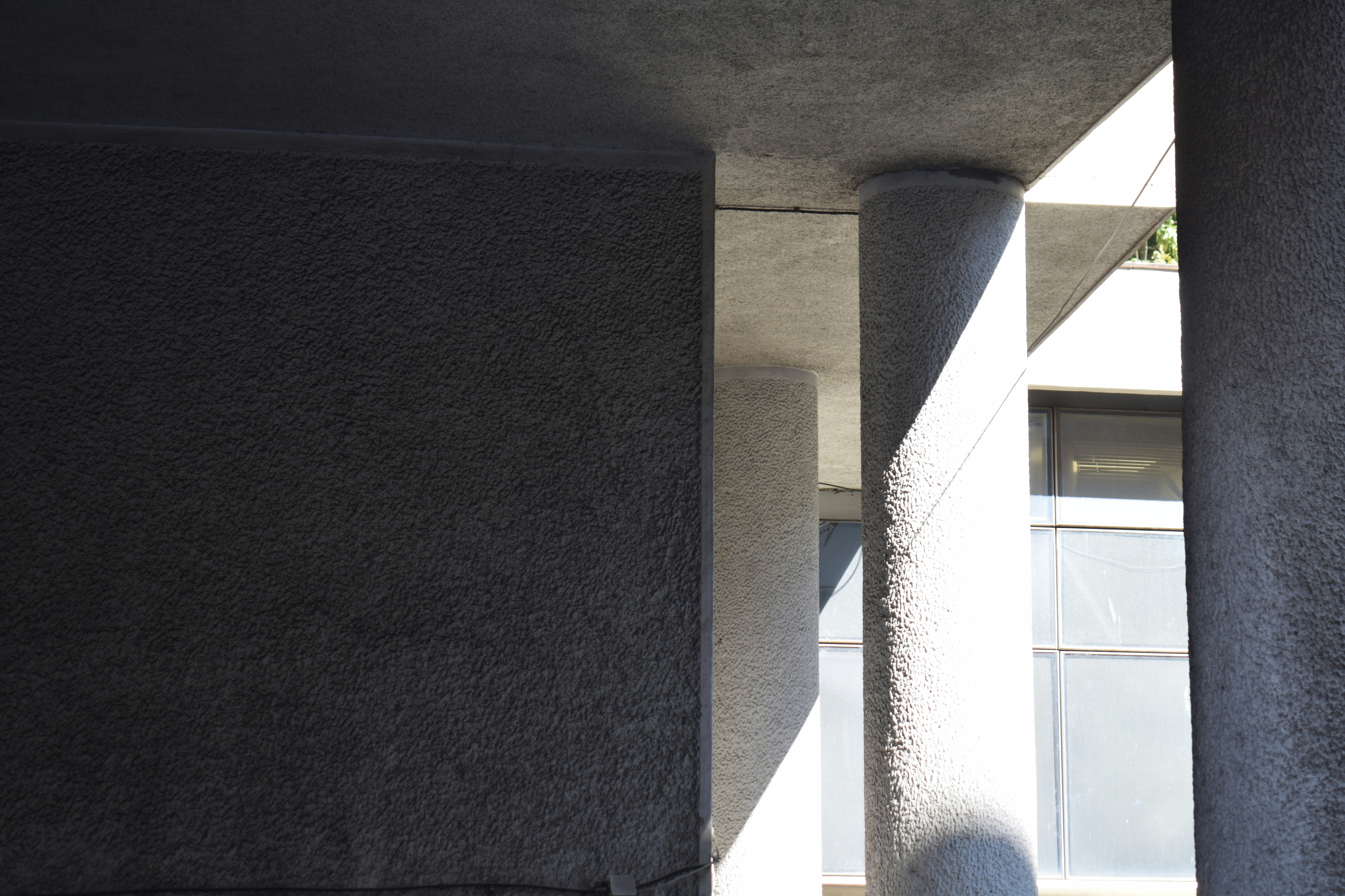 Concrete columns and textured wall - Free Photo on Unsplash