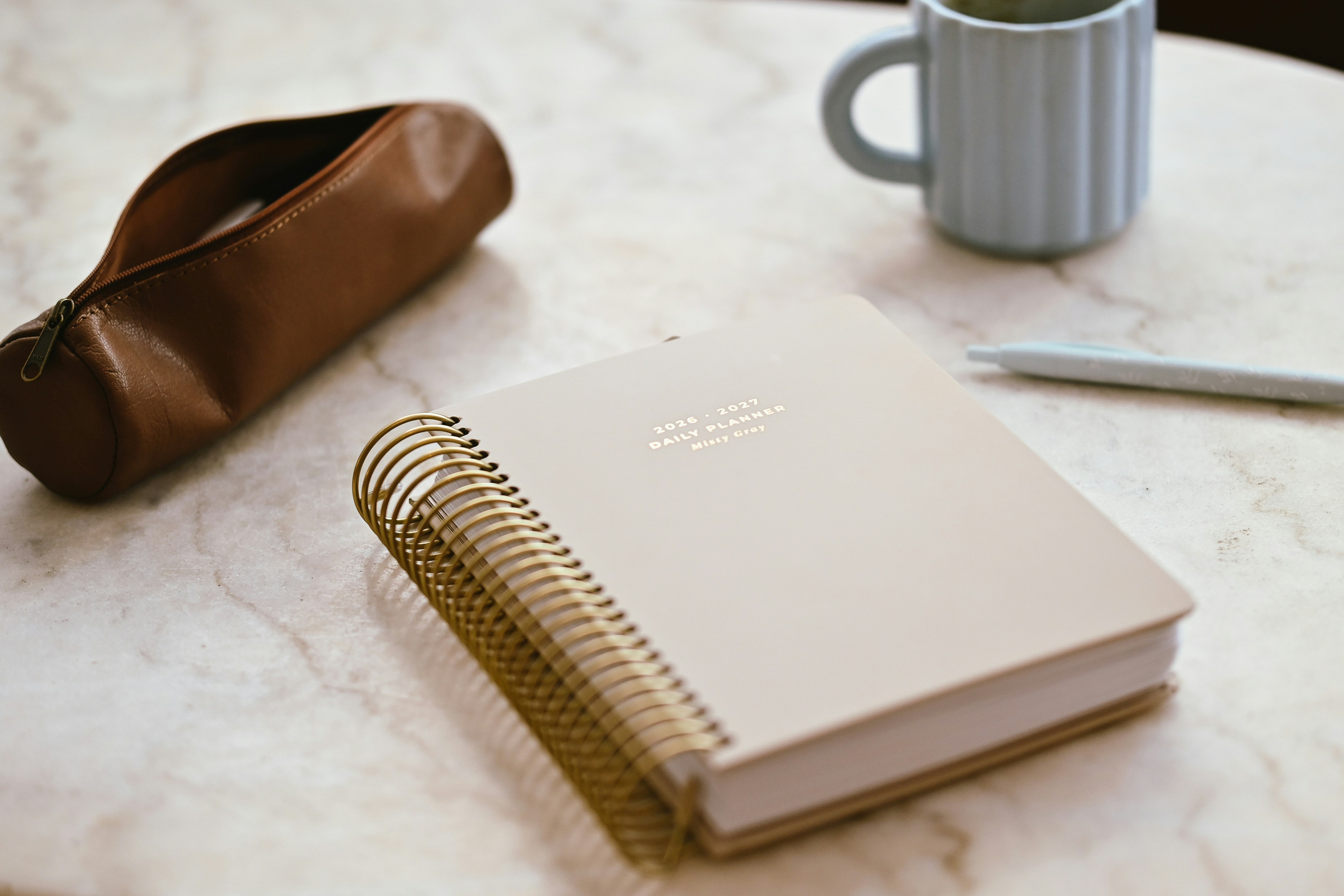 Beige spiral planner and pencil case