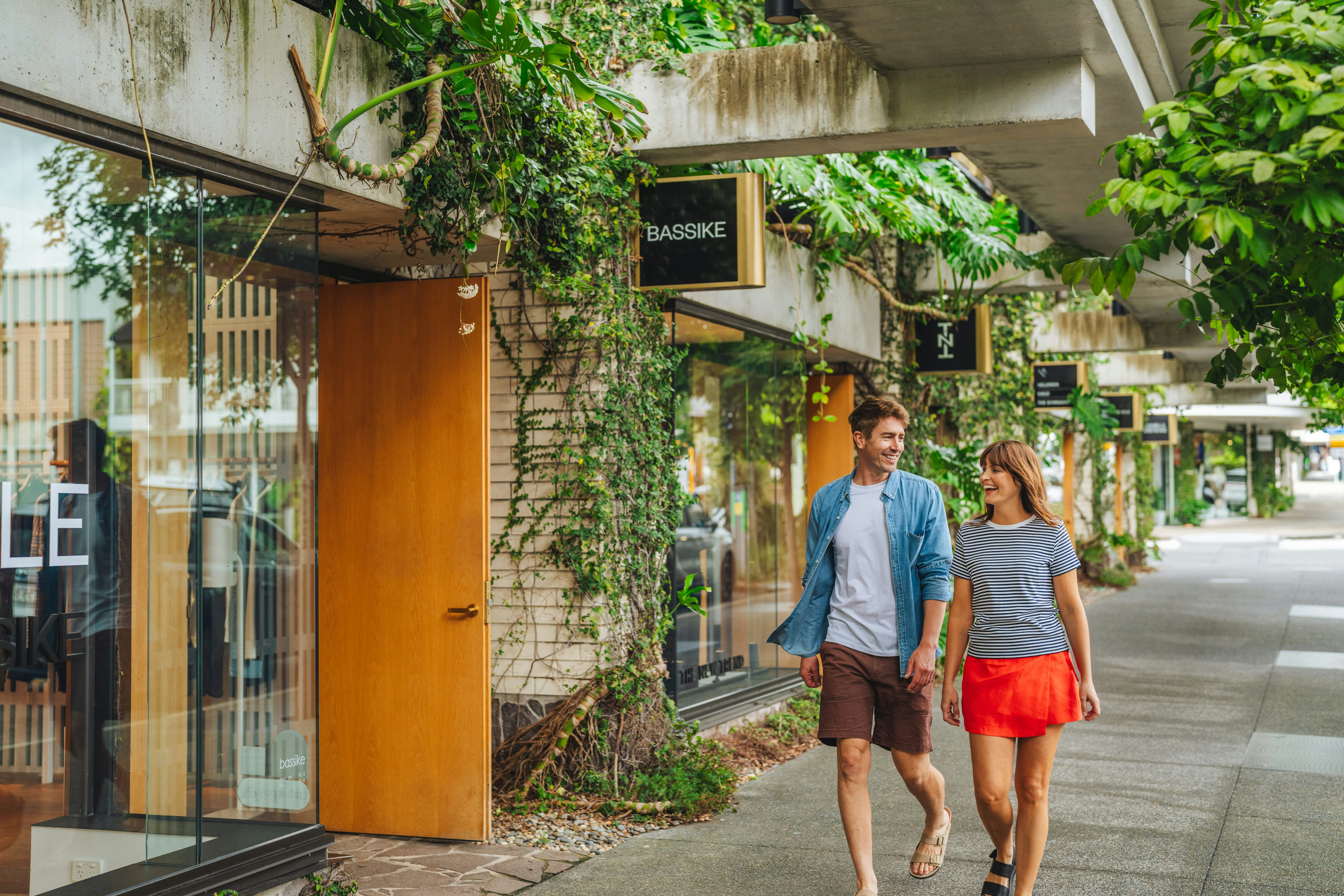 Couple walking through the iconic luxury retail precinct. Location: Fortitude Valley, James Street, Brisbane