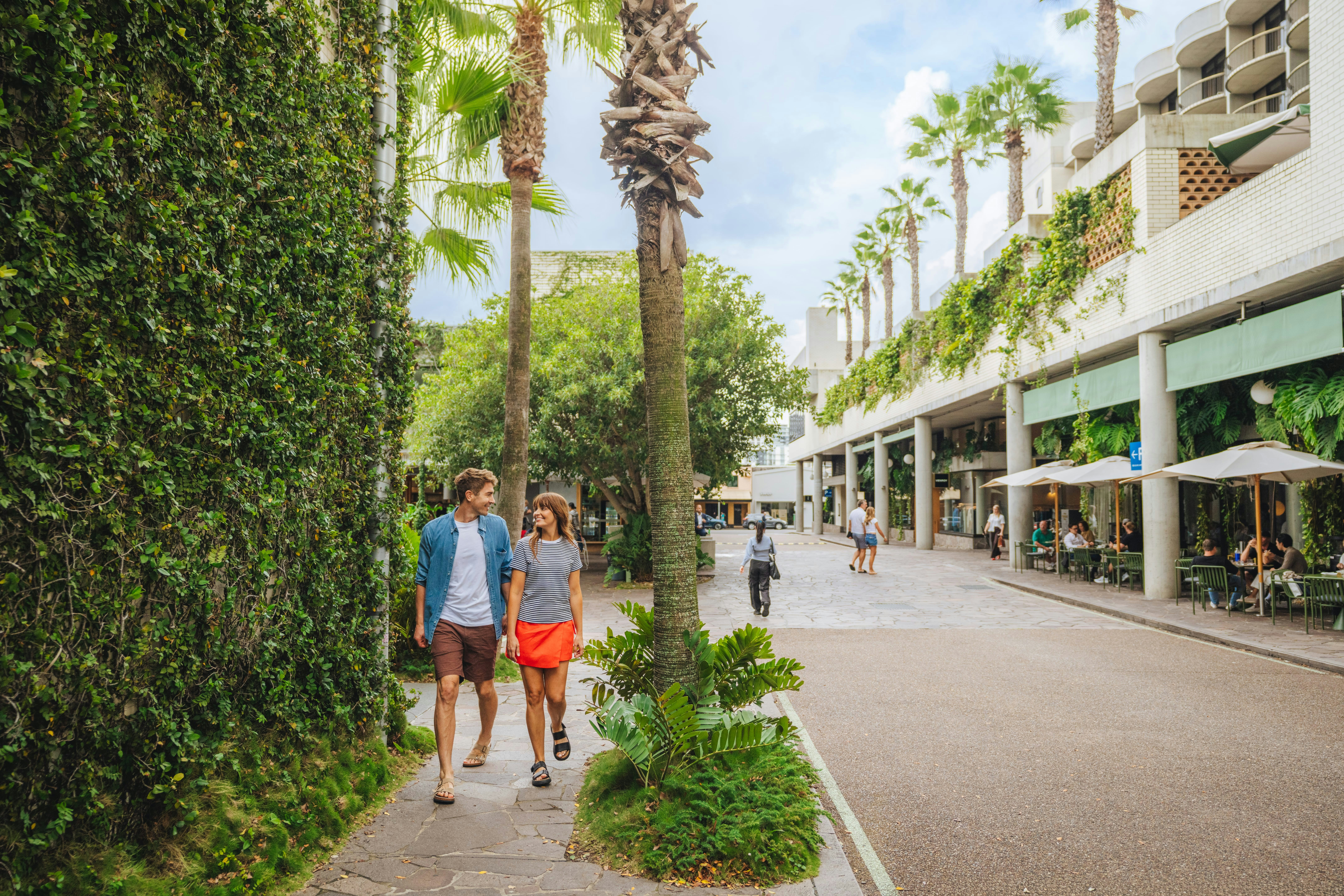 Couple walking through the iconic luxury retail precinct