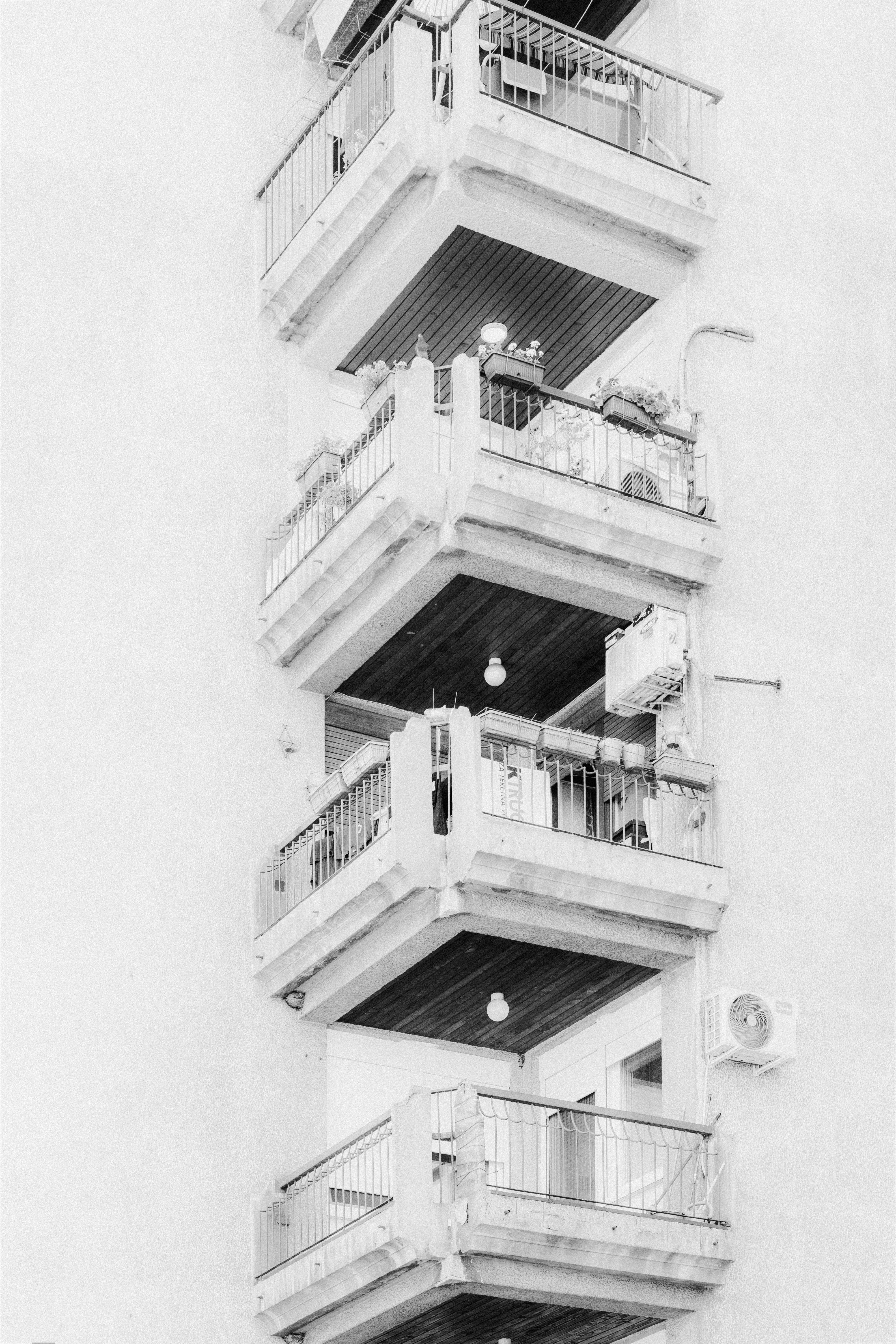 Stacked concrete balconies on a residential building