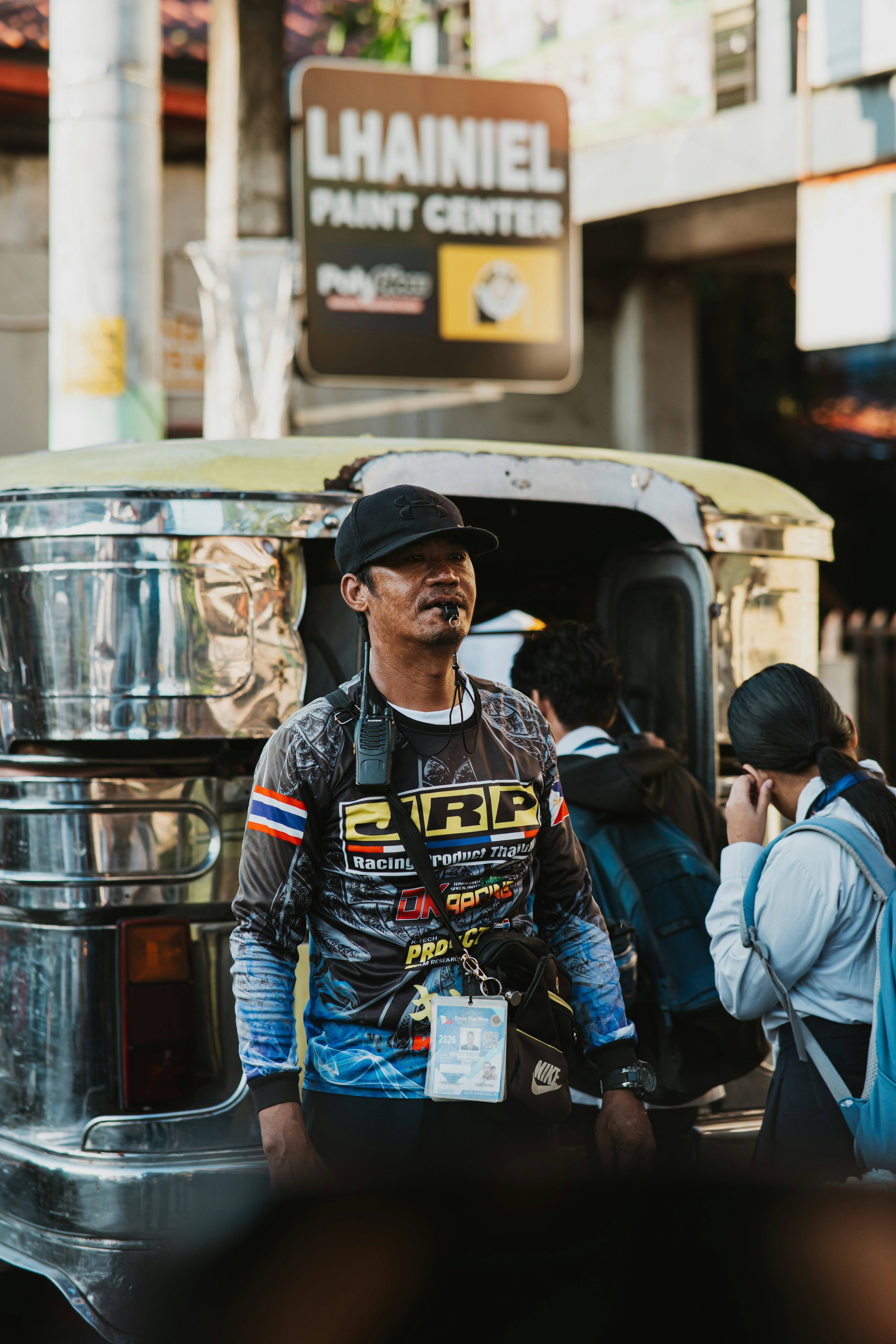Man standing before a jeepney - Free Photo on Unsplash