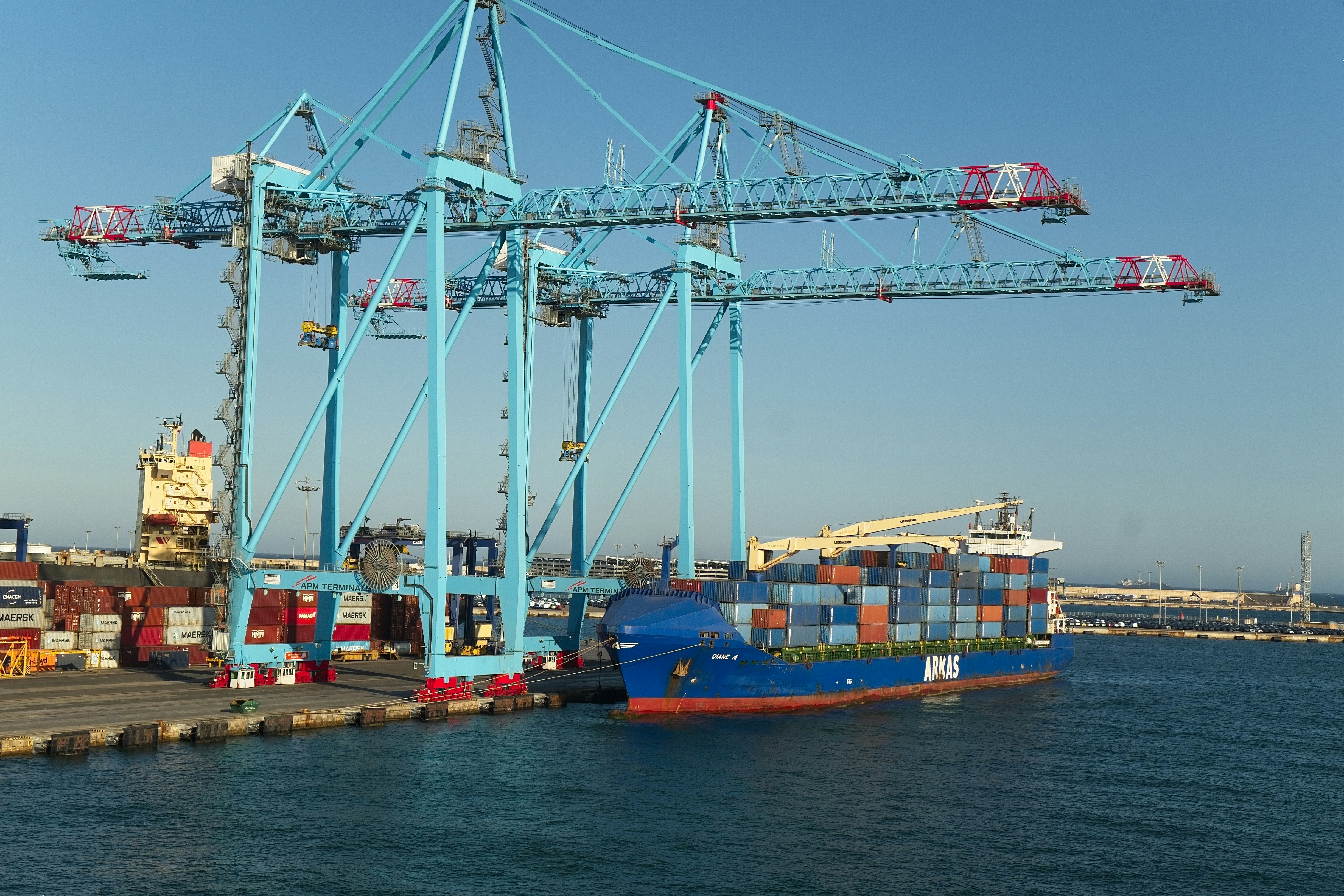 Container ship at port with cranes - Free Photo on Unsplash