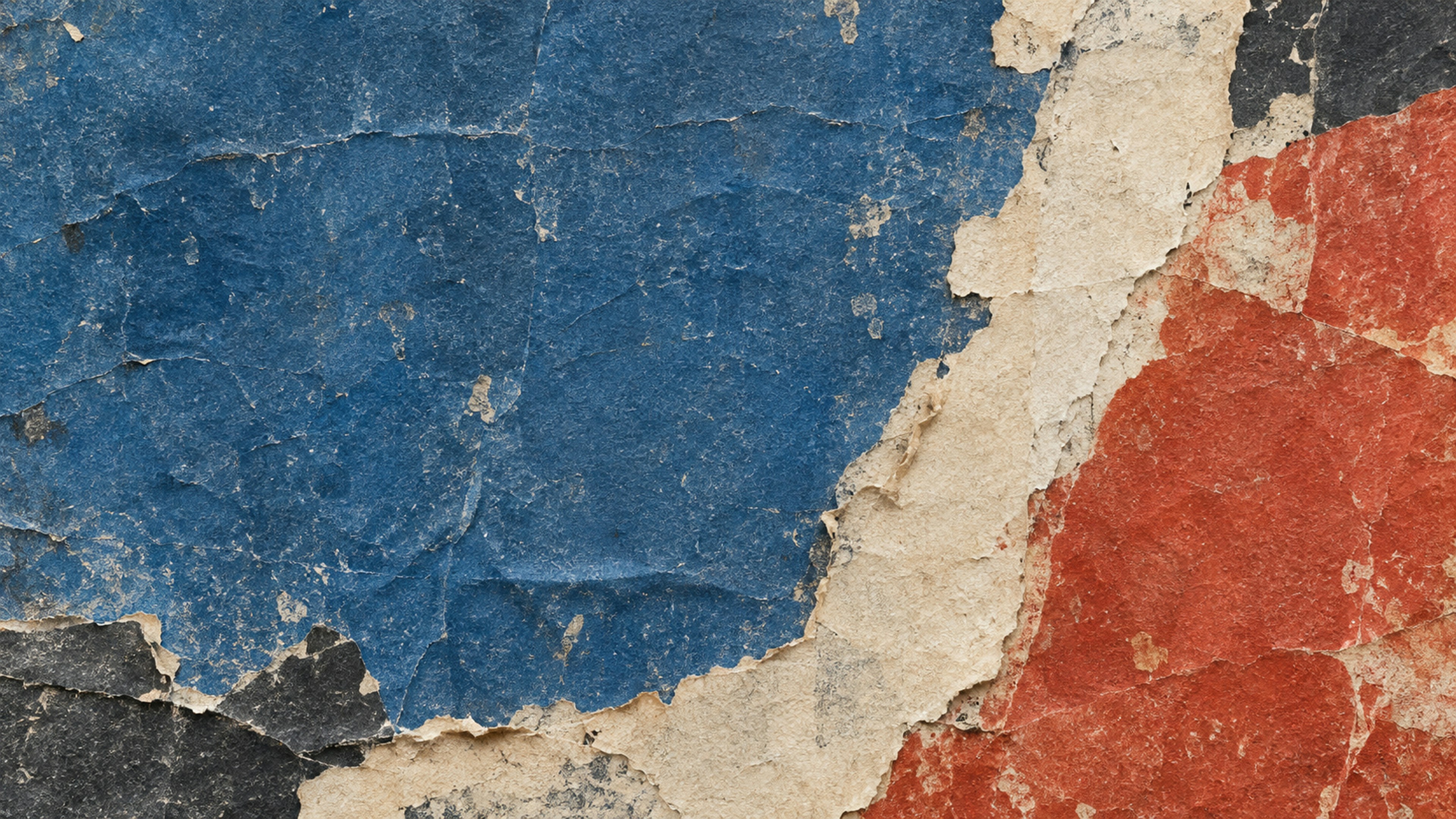 Layers of torn blue, red, and beige paper with a rough textured surface