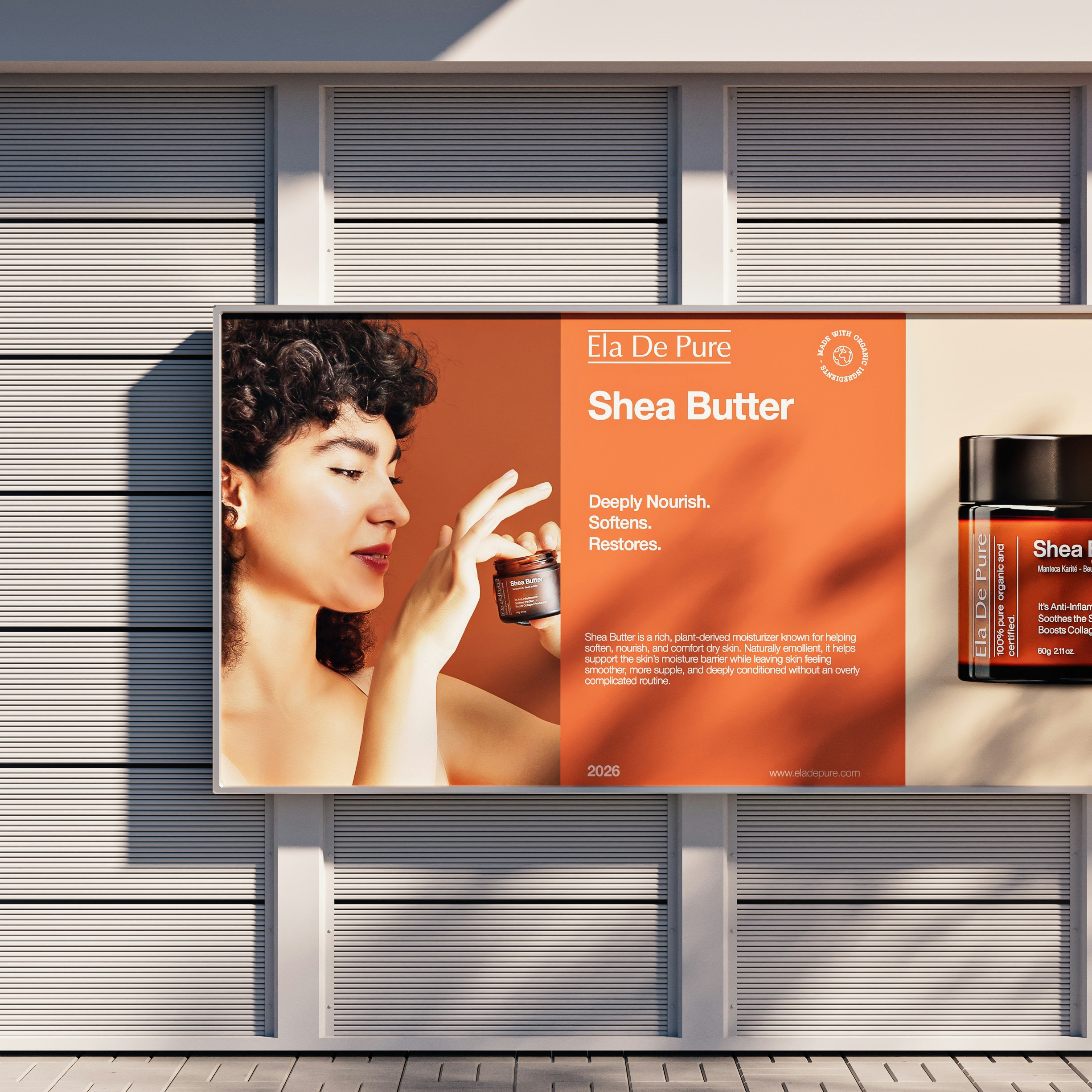 A billboard advertisement featuring a woman holding a jar of shea butter cream