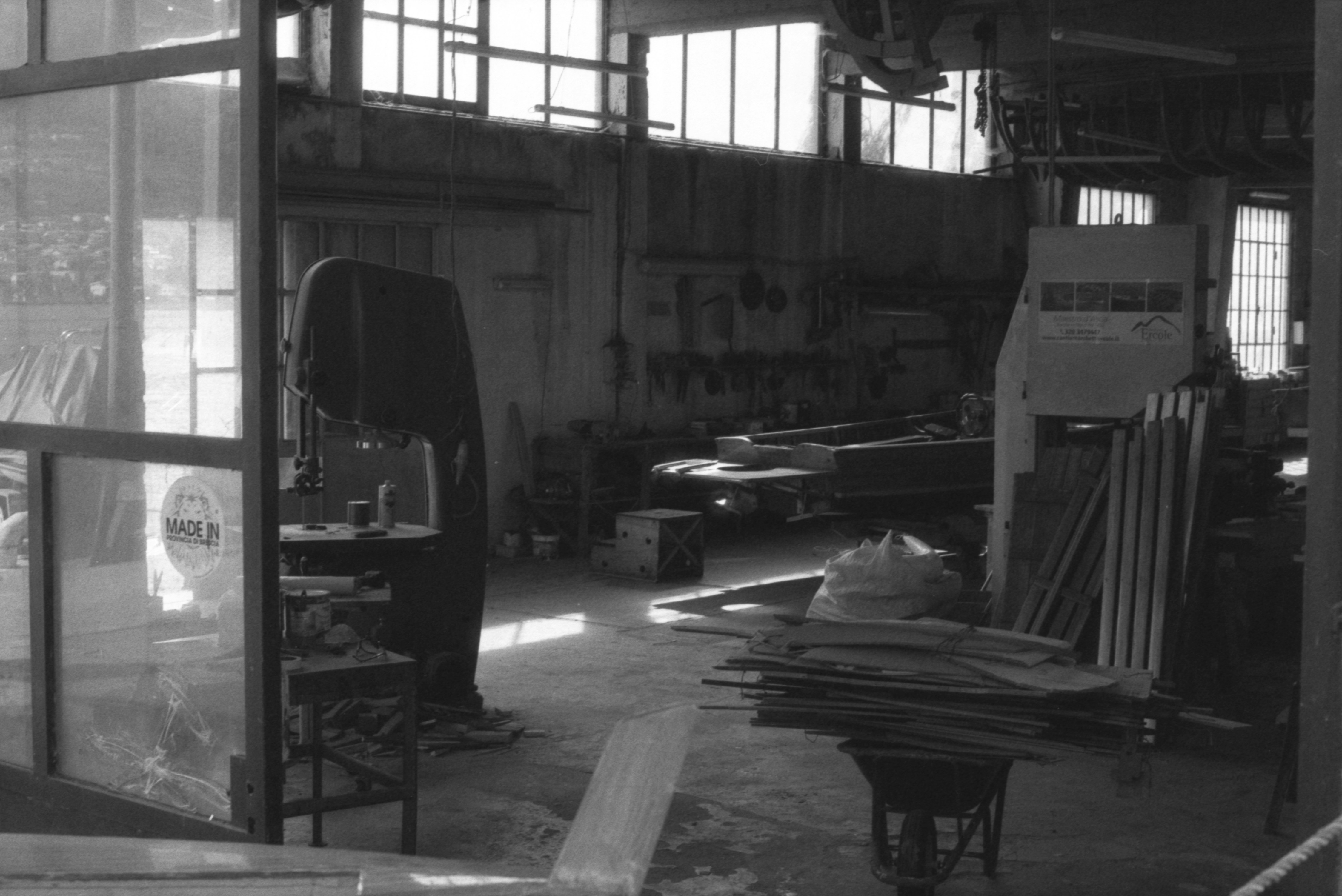 Laser engraving machine cutting a sheet of wood in the workshop