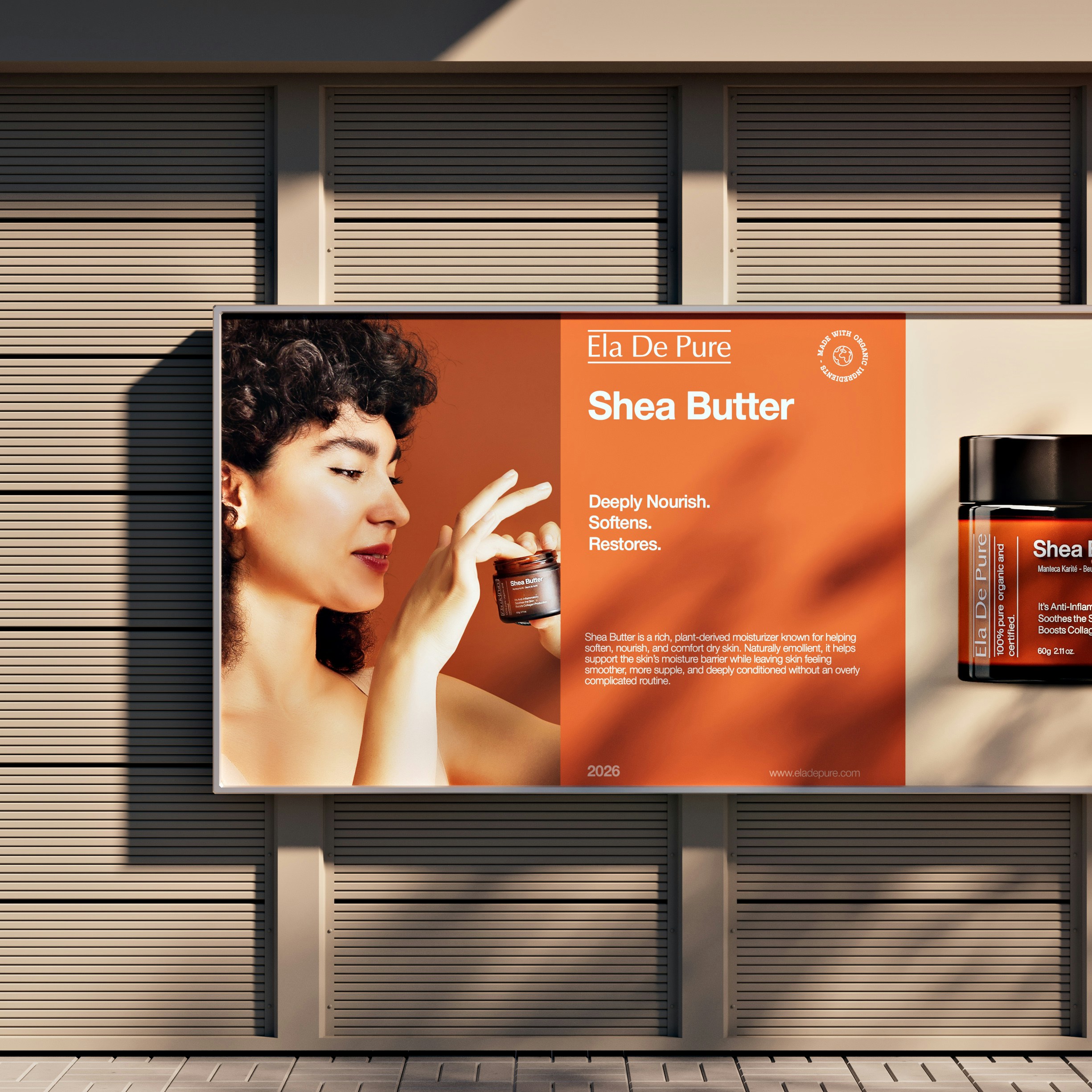A billboard advertisement featuring a woman holding a small jar of shea butter