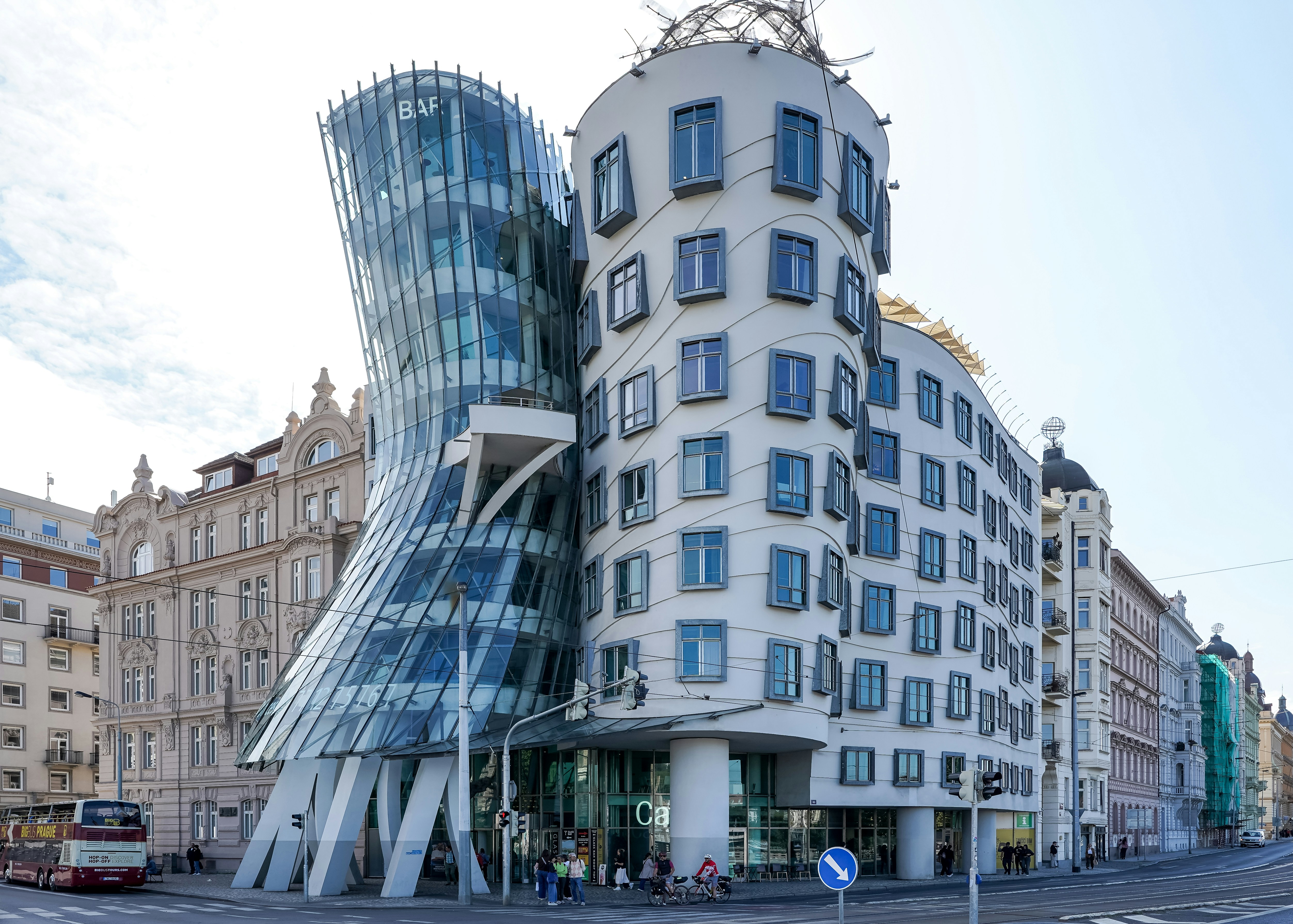 The Dancing House building with glass and concrete facades on a street in Prague