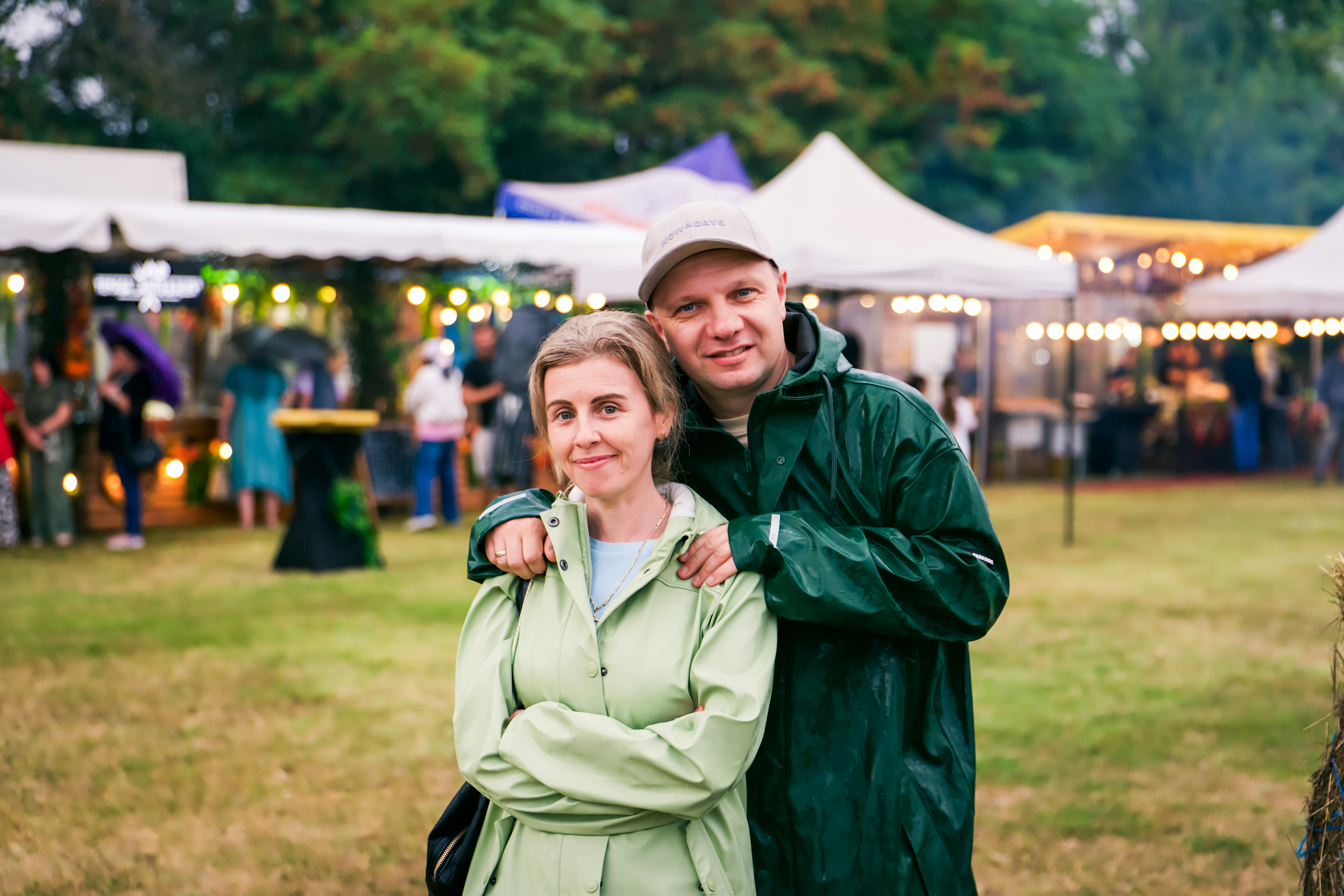 outdoor festival crowd in raincoats