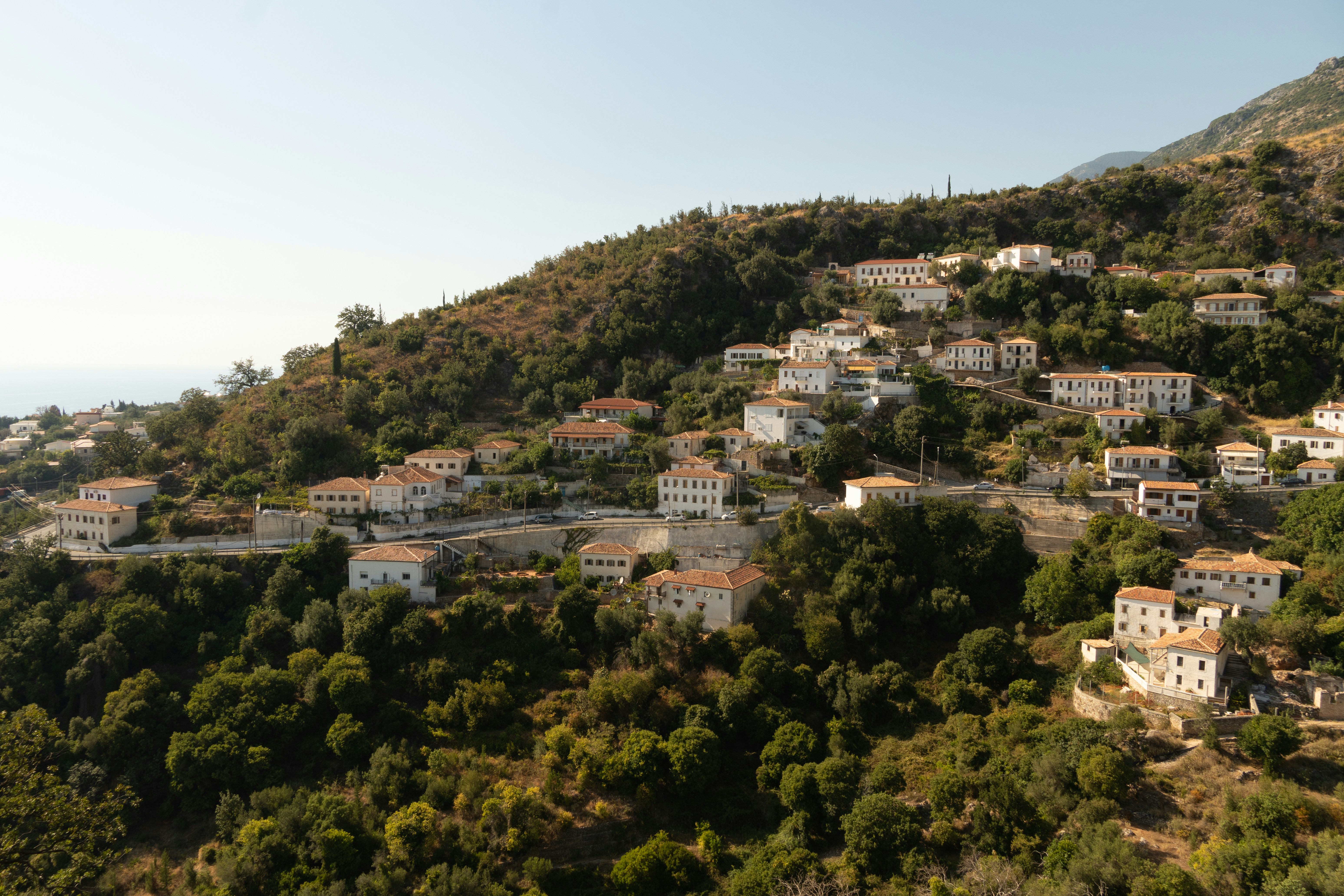 Lindos hillside village on Rhodes with white terracotta-roof houses above the Aegean Sea