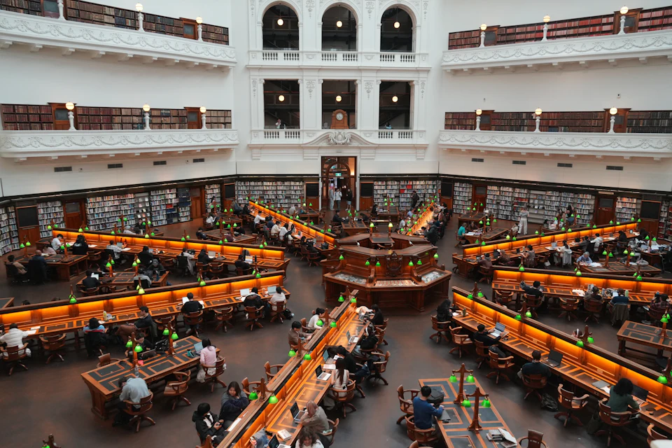 Wooden desks in a library reading room