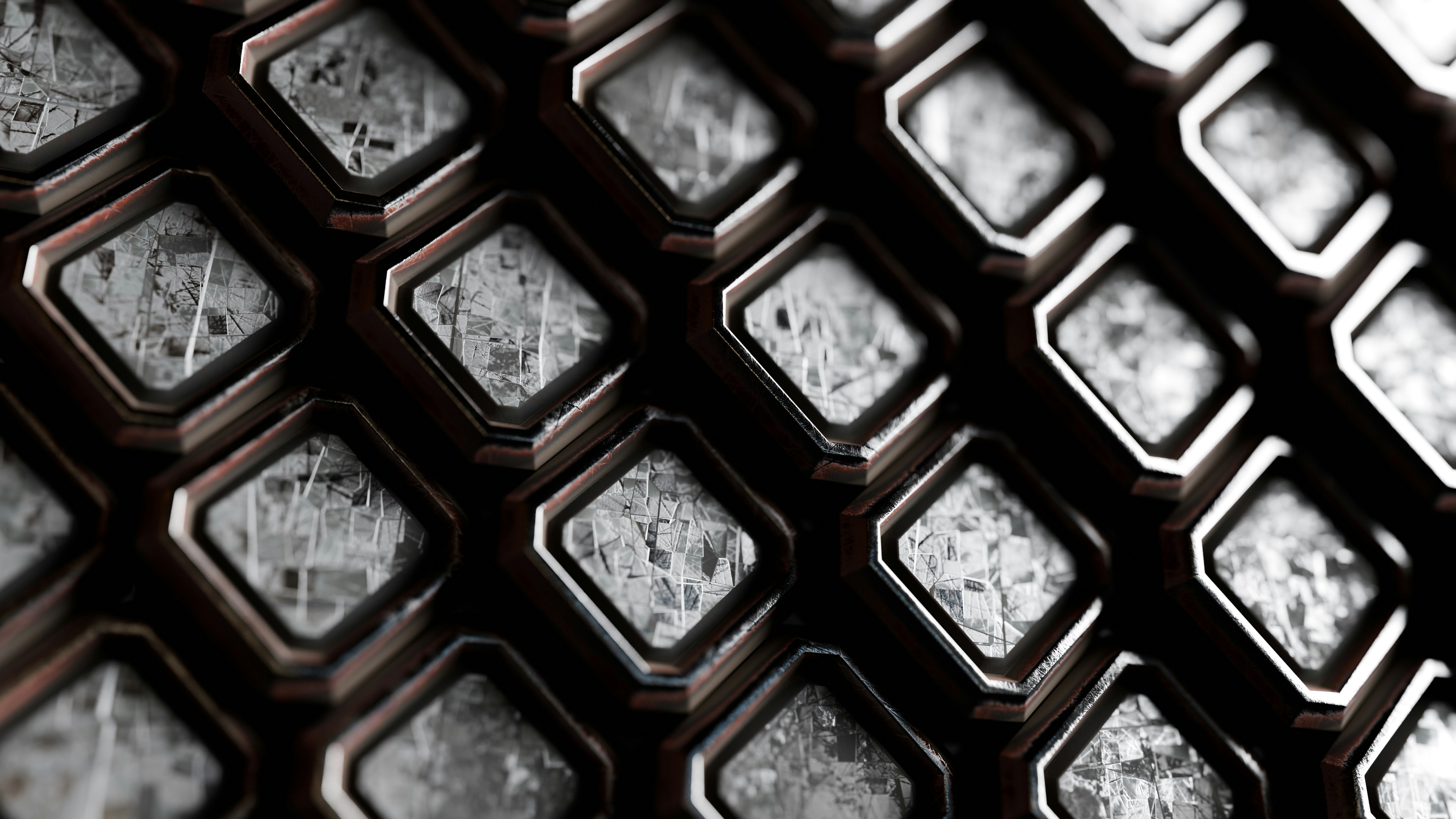A grid of square tiles with dark frames and textured grey stone surfaces