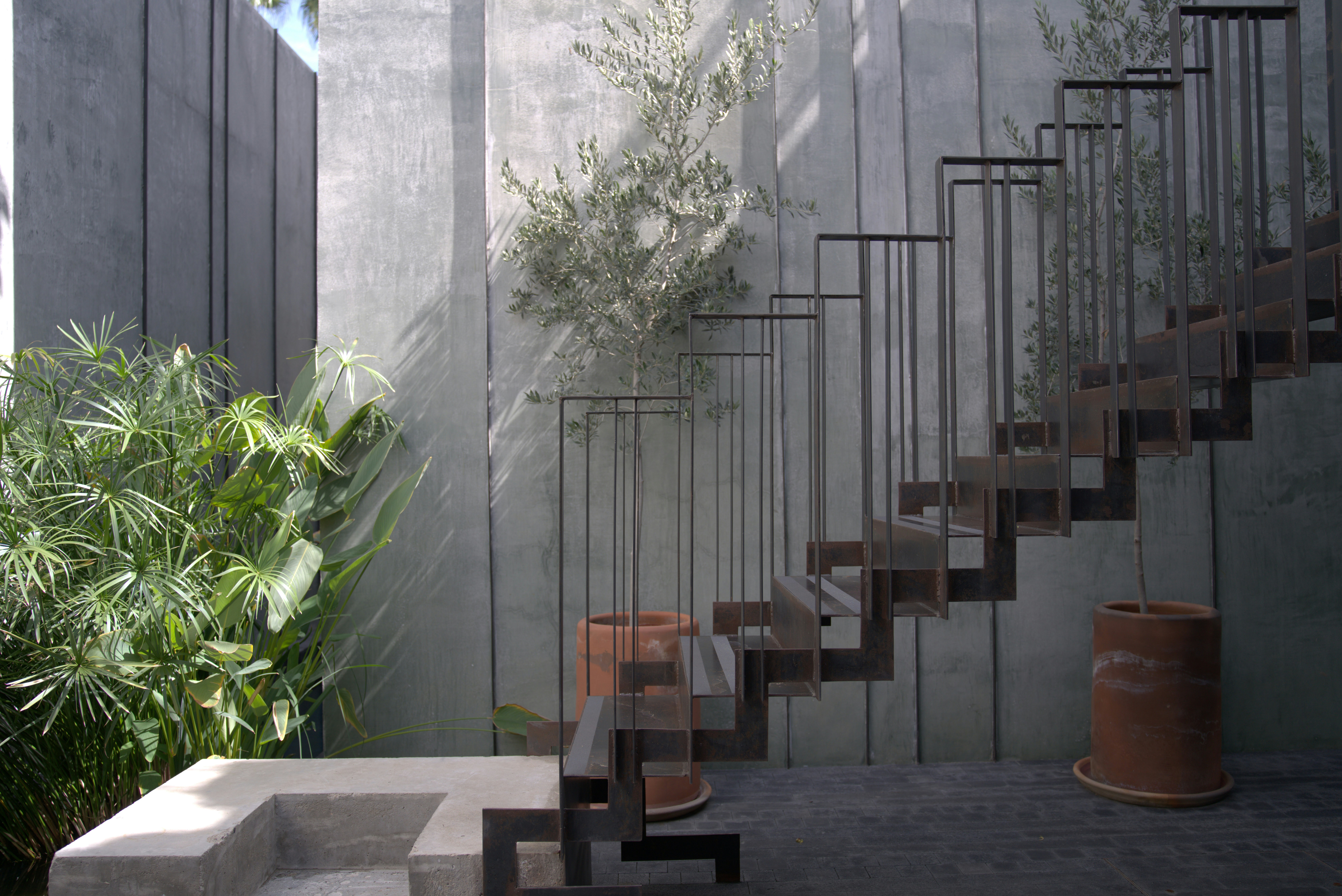 Metal staircase against concrete wall - Free Photo on Unsplash