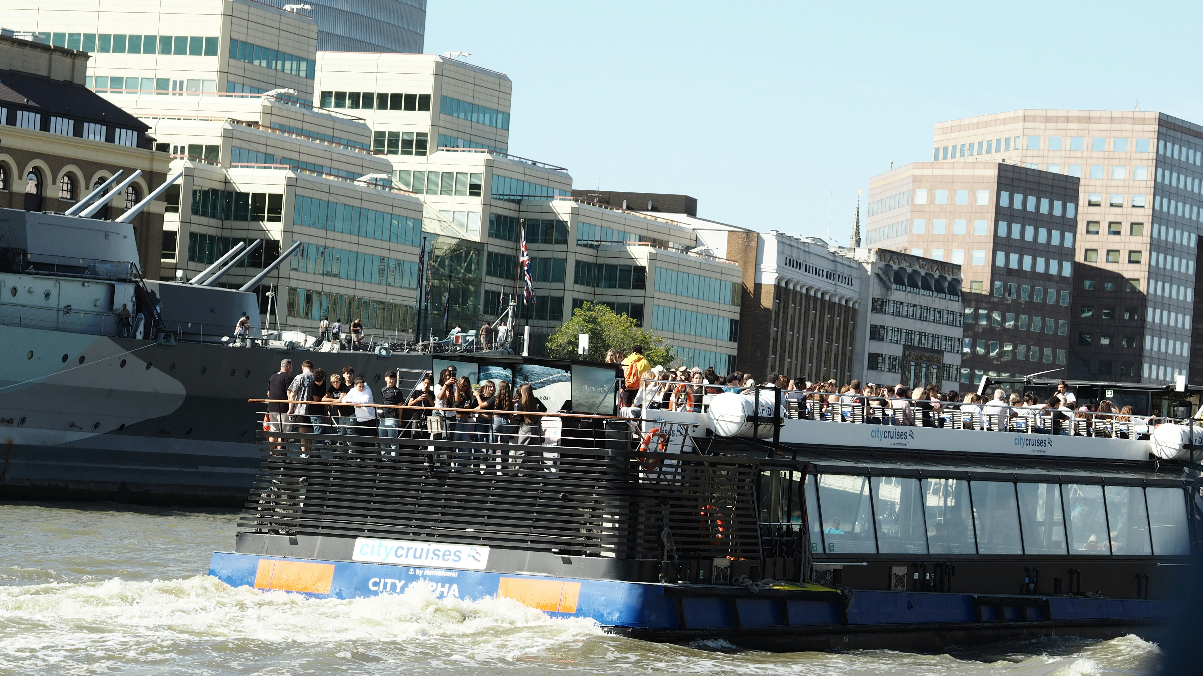 A City Cruises boat carrying passengers on the River Thames in London