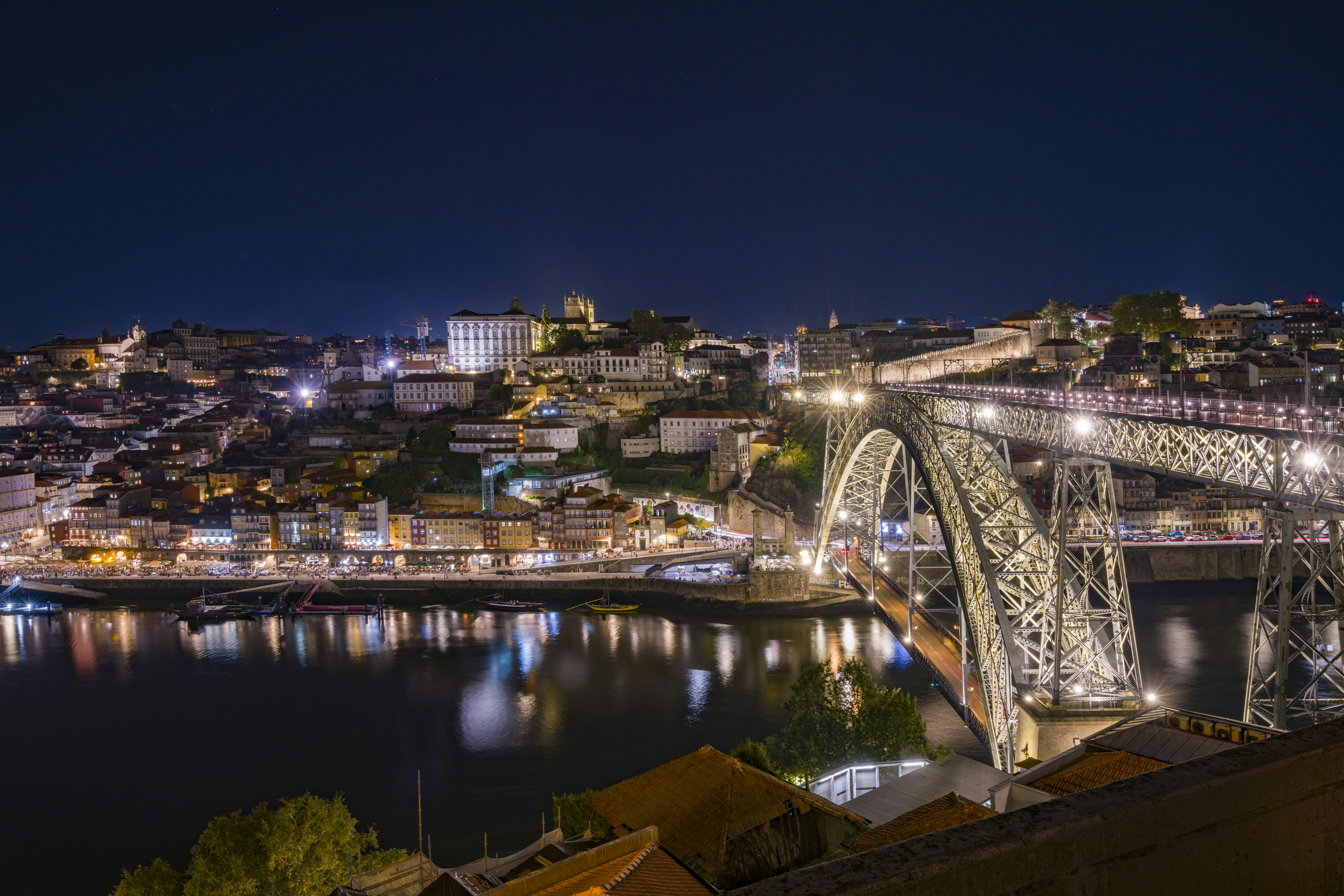The Dom Luís I Bridge illuminated at night over the Douro River in Porto