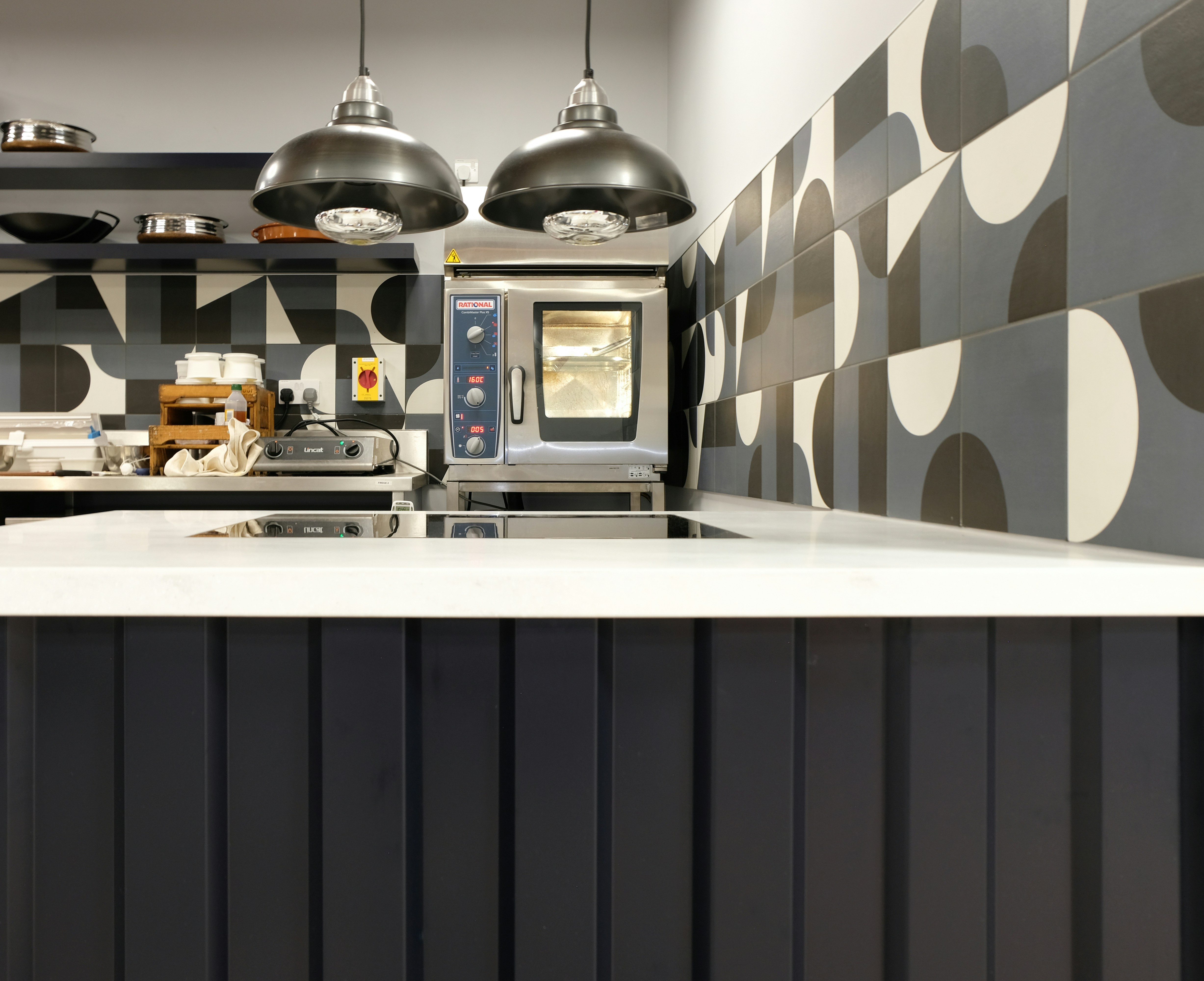 Professional commercial kitchen with stainless steel equipment