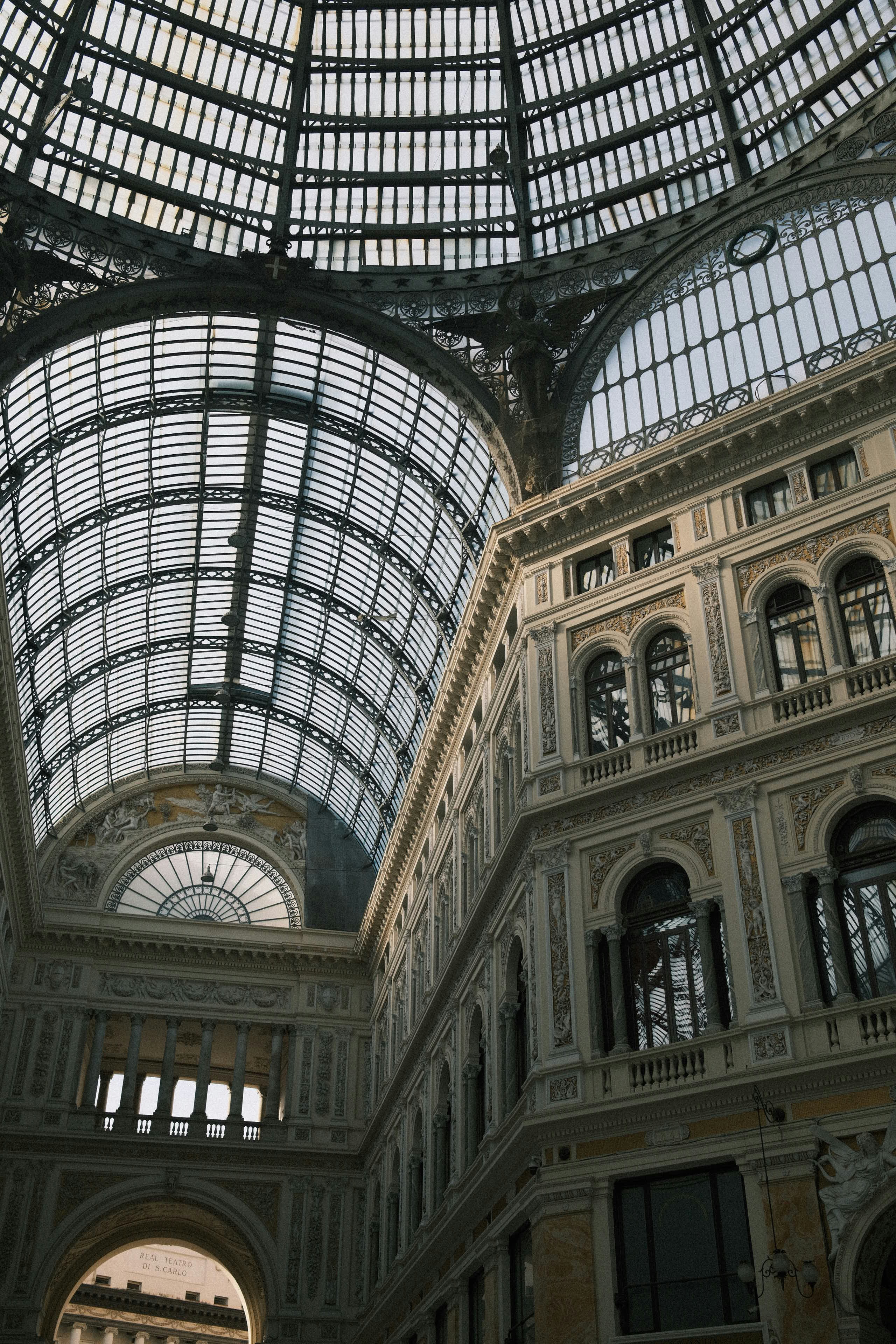 The glass and iron vaulted ceiling of the Galleria Umberto I in Naples