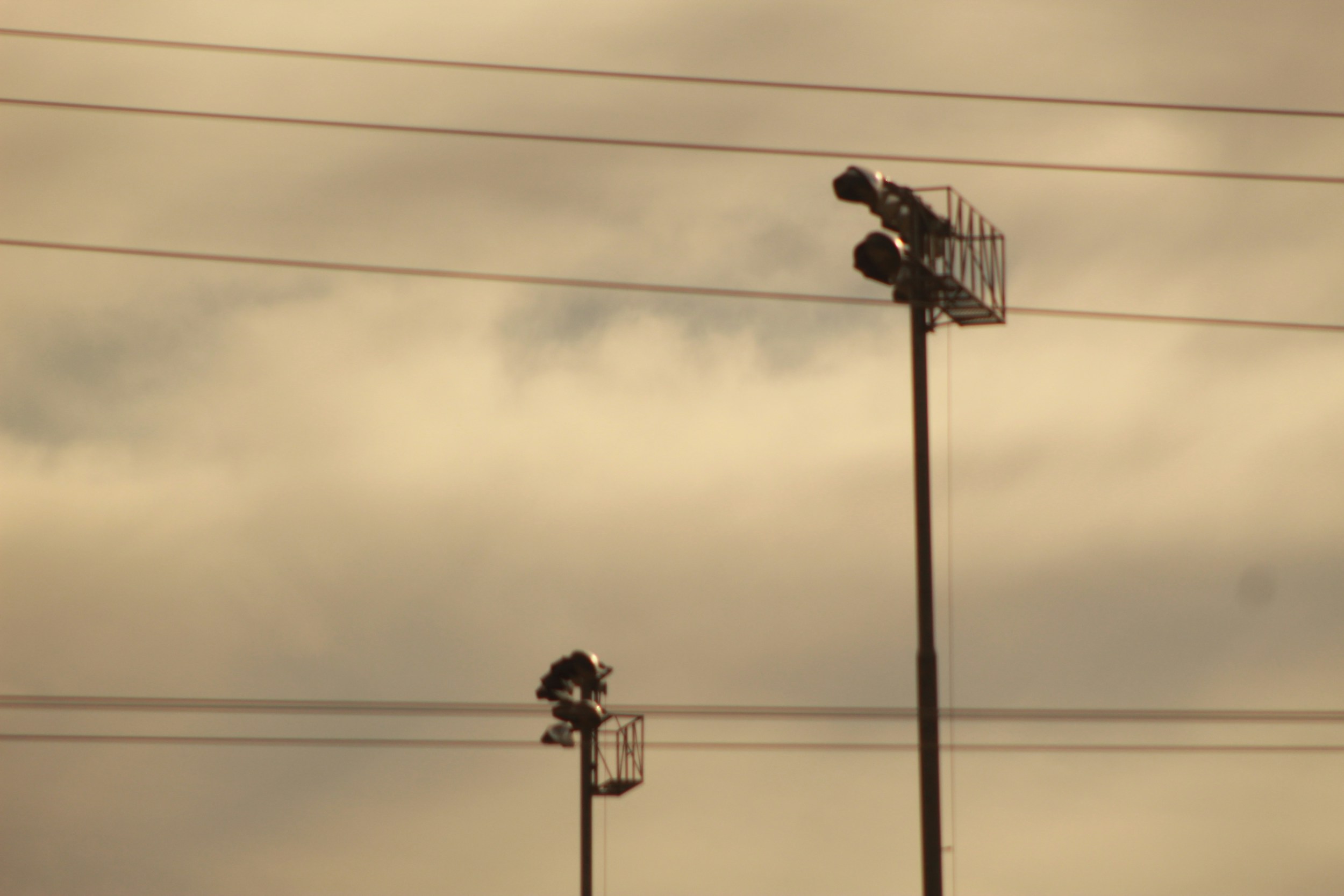 football striker silhouette floodlights